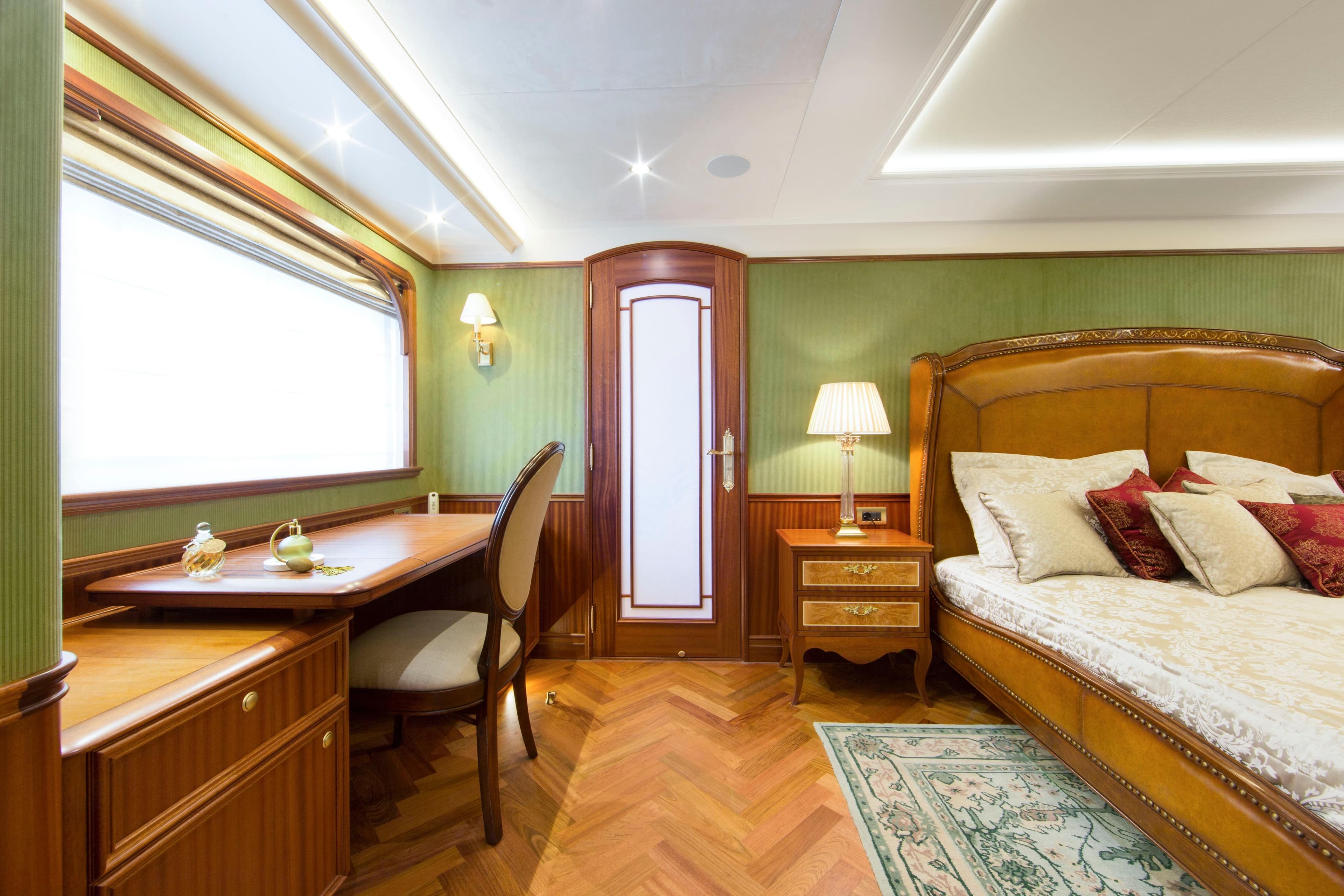 Luxurious bedroom interior of 2026 Van der Valk Explorer 37M yacht with elegant furnishings.