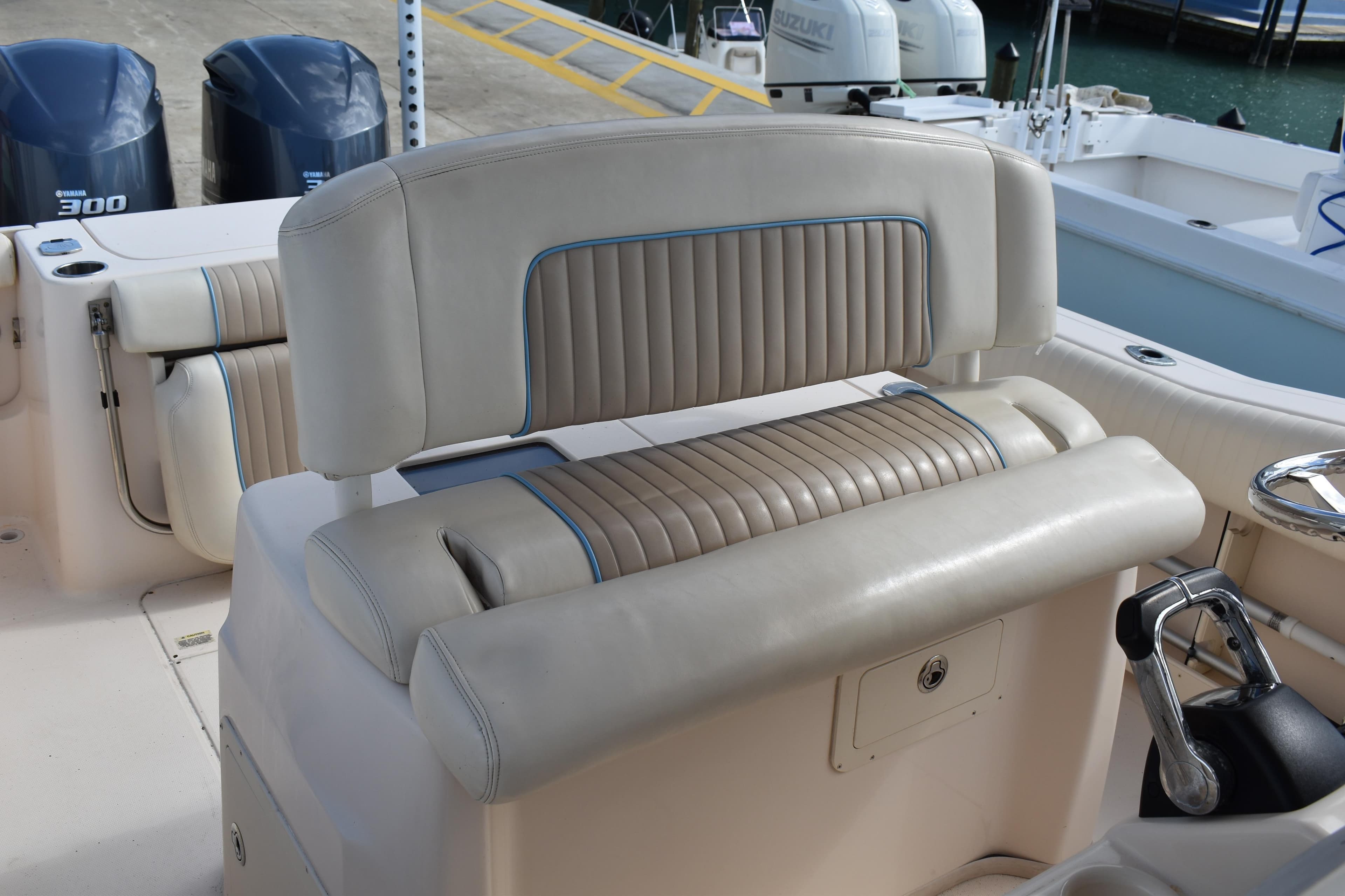 2012 Grady-White Canyon 271 boat interior with cushioned seating and dual Yamaha 300 engines.