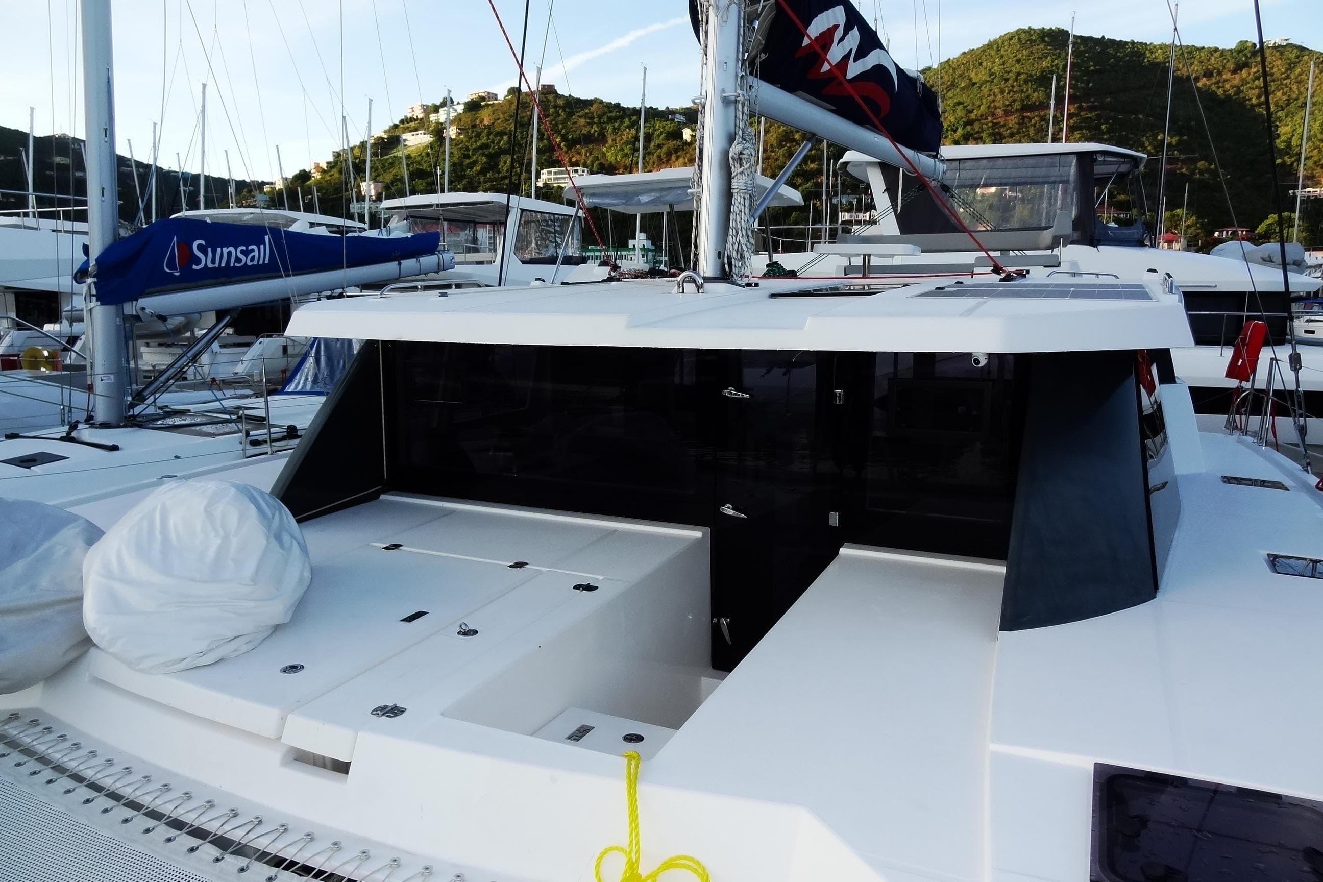 2024 Robertson and Caine Leopard 42 catamaran docked in a marina.