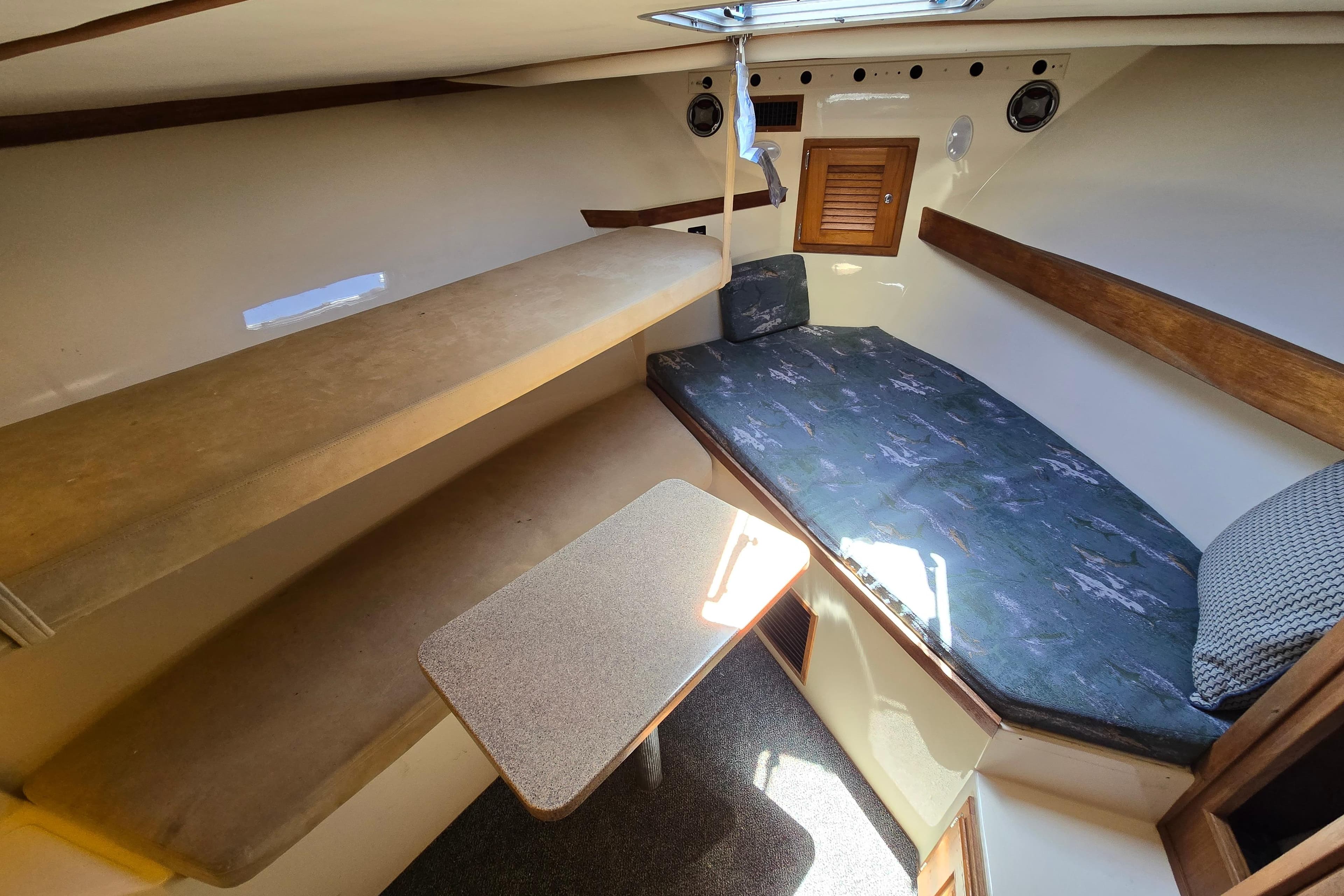 2003 Albemarle 305 Express Fisherman cabin interior with seating and table.
