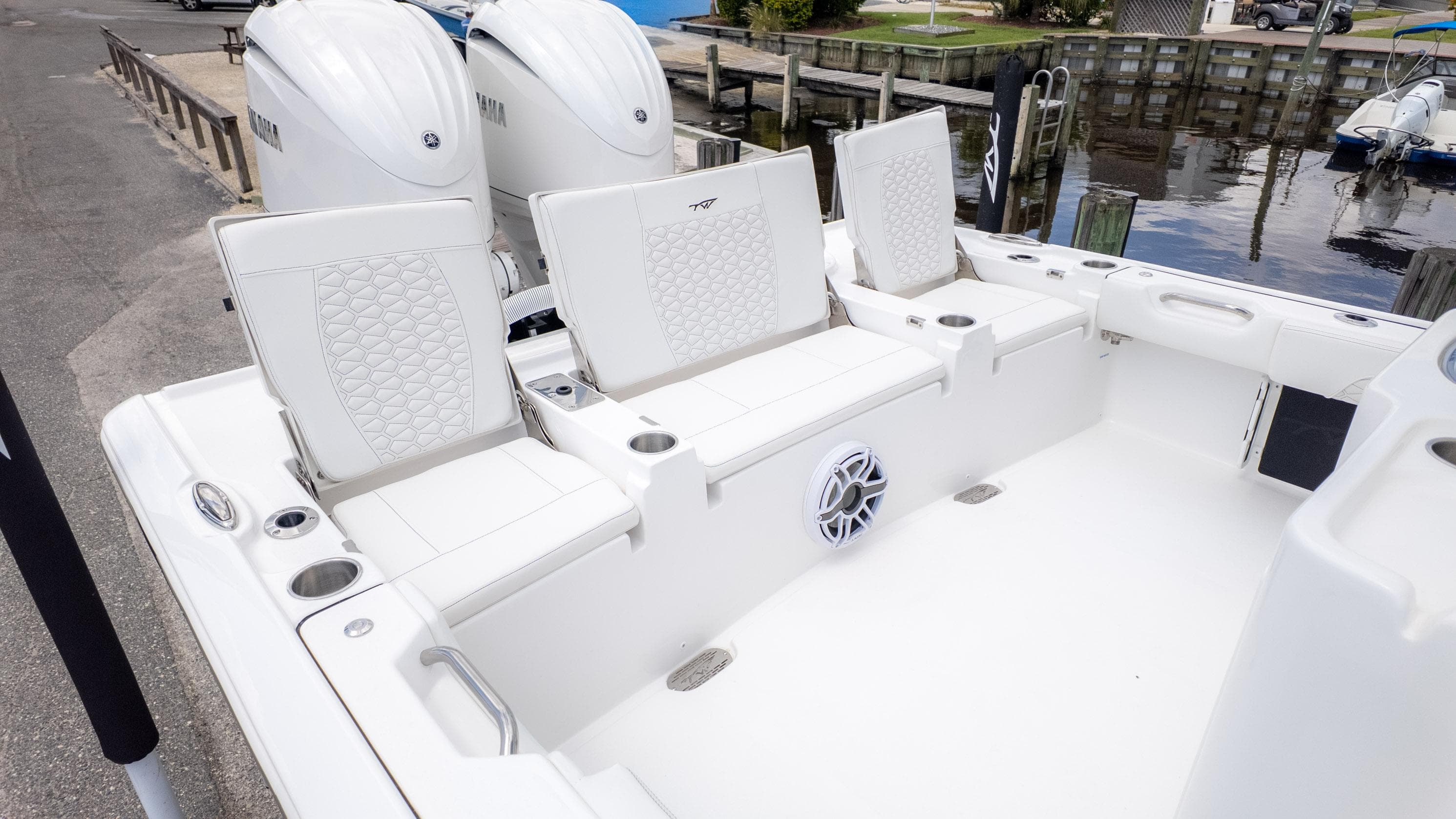 2026 Tidewater 2700 Carolina Bay boat interior with white seating and dual Yamaha engines.
