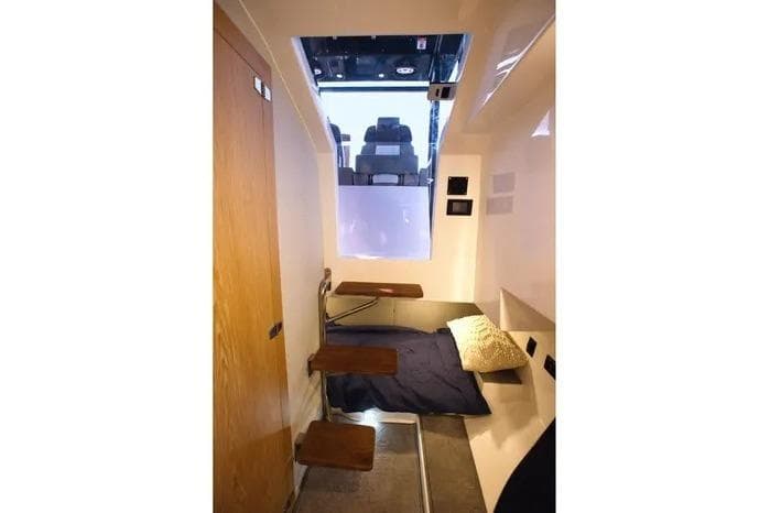 Interior cabin of 2026 SeaWell 345XL boat with compact sleeping area.