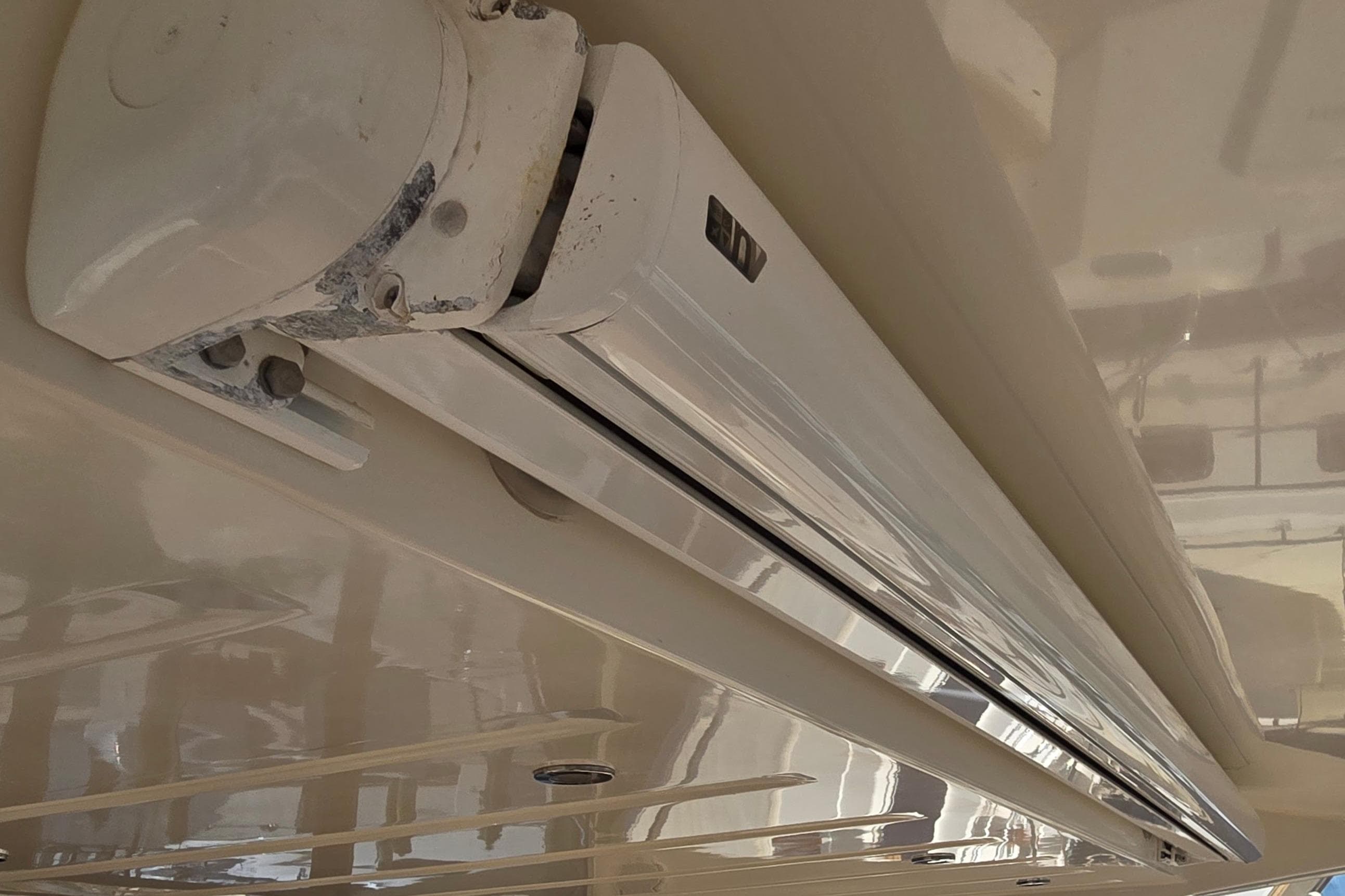 Close-up of a 2013 Prestige 500 yacht's retractable awning mechanism.