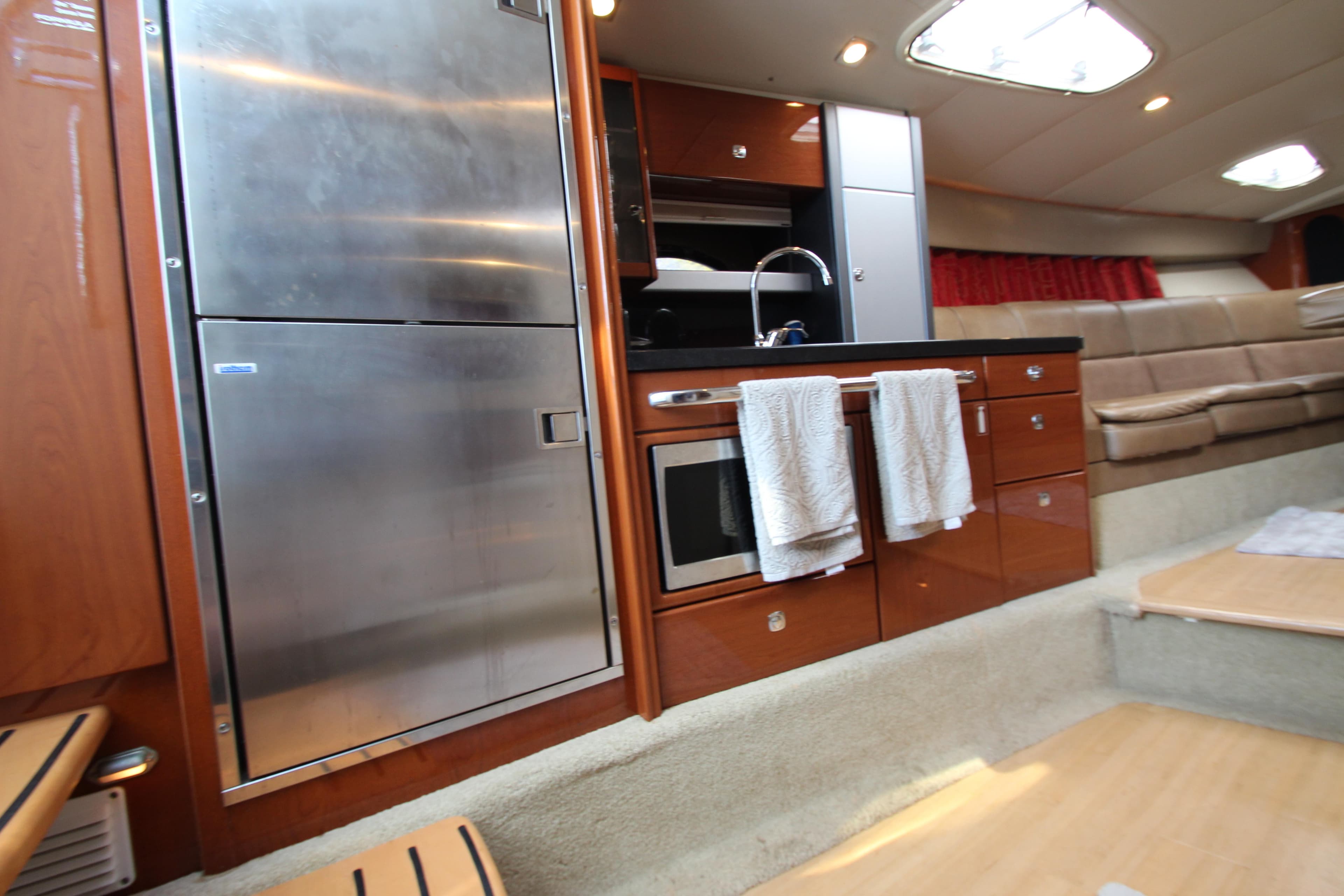 2012 Formula 400 Super Sport yacht interior kitchen with stainless steel appliances.