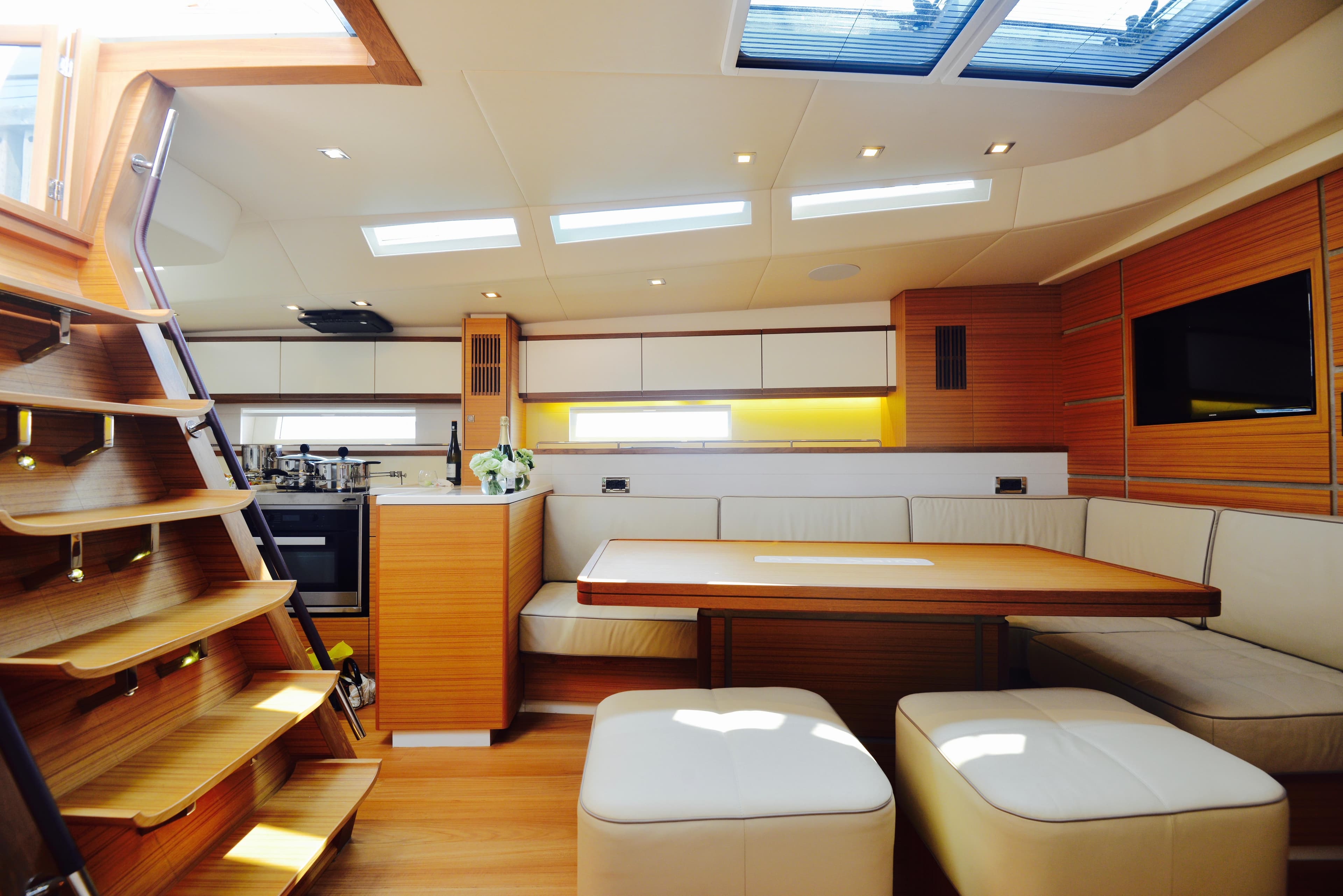 Luxurious interior of 2017 Mazarin 72 Cruiser/Racer yacht with modern seating and skylights.