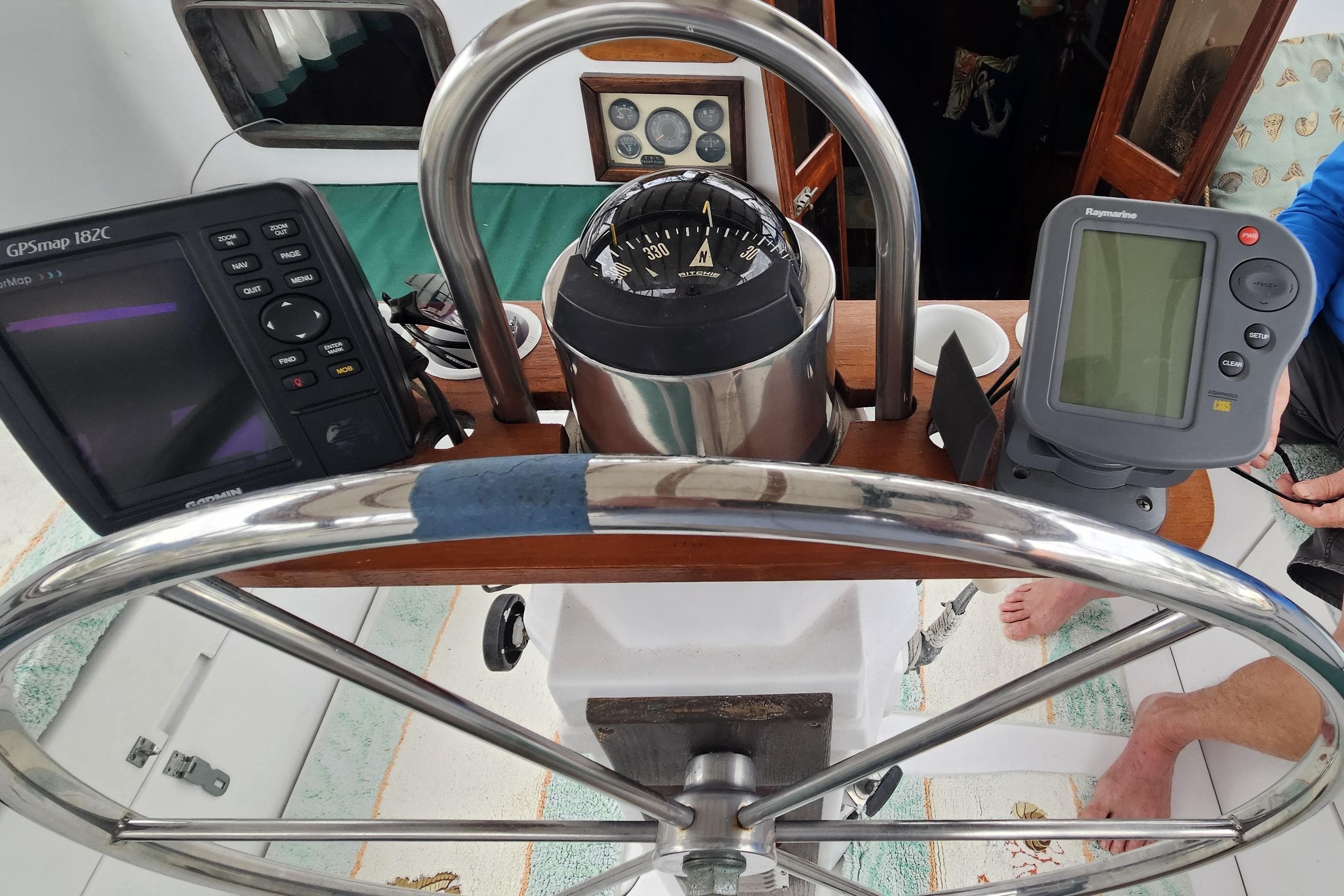 Steering wheel and navigation instruments on a 1979 CSY 44 CC sailboat.