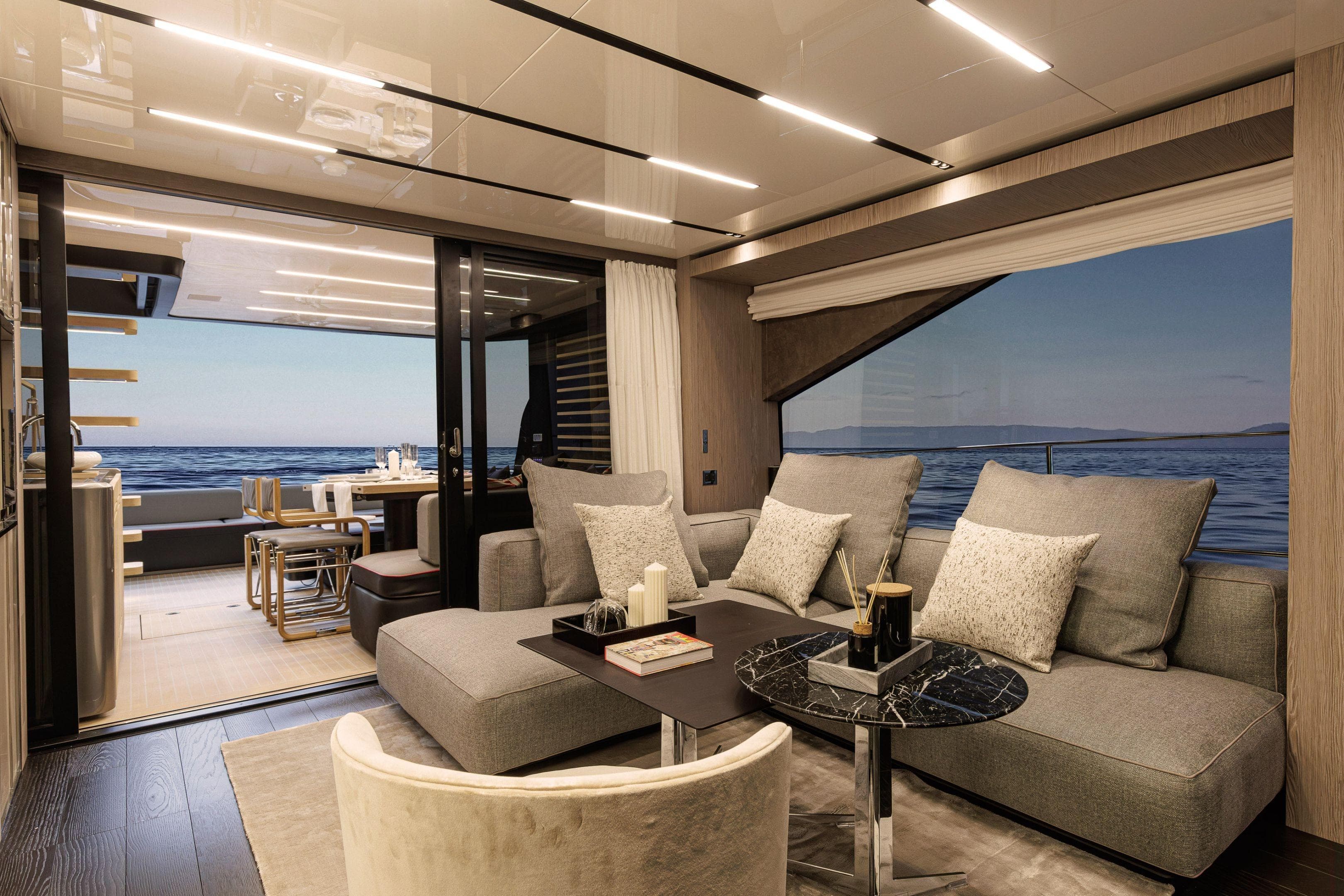 Luxurious interior of 2026 Cranchi Sessantasette 67 Corsa yacht with ocean view.