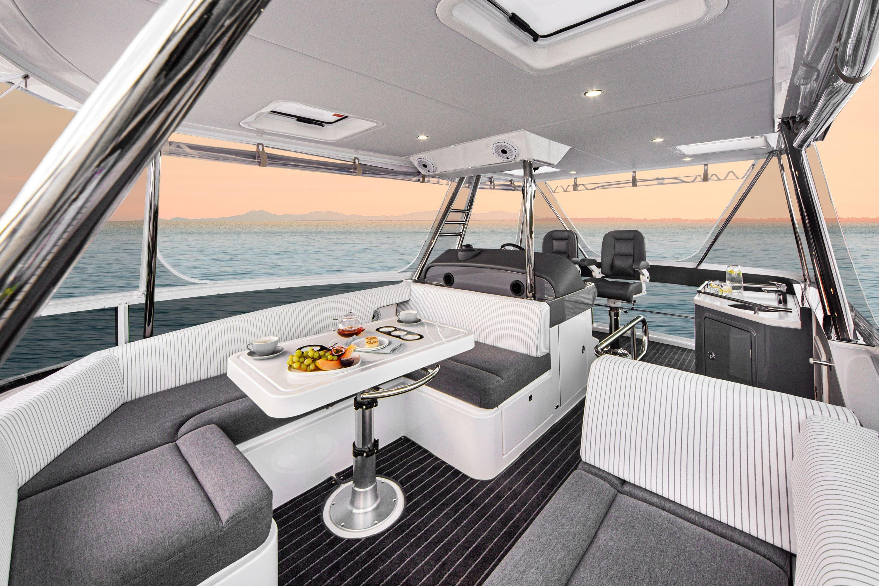 2025 Riviera 46 Sports Motor Yacht interior with elegant seating and ocean view.
