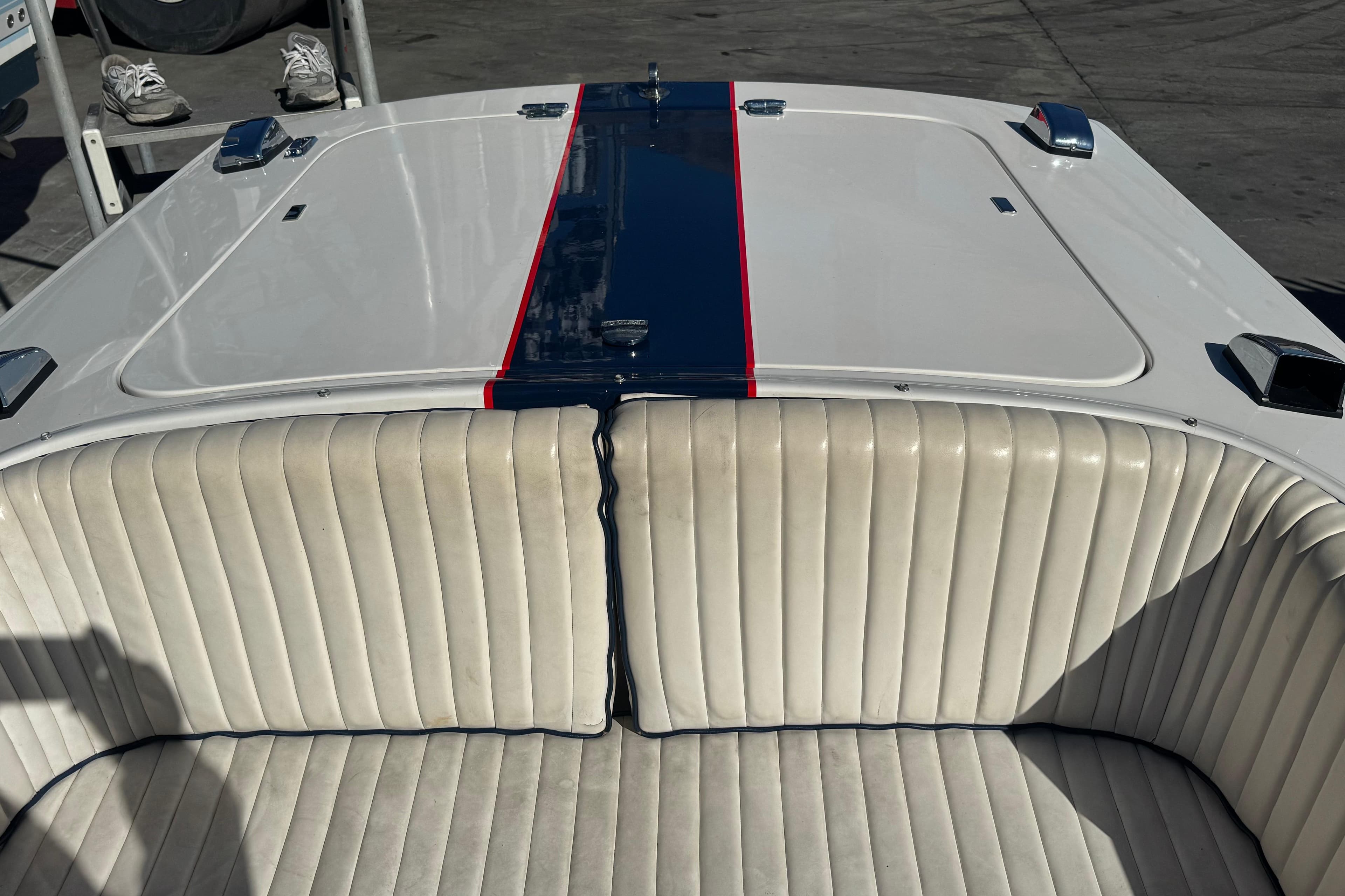 2002 Donzi 22 Shelby GT boat with white seating and blue stripe detail.