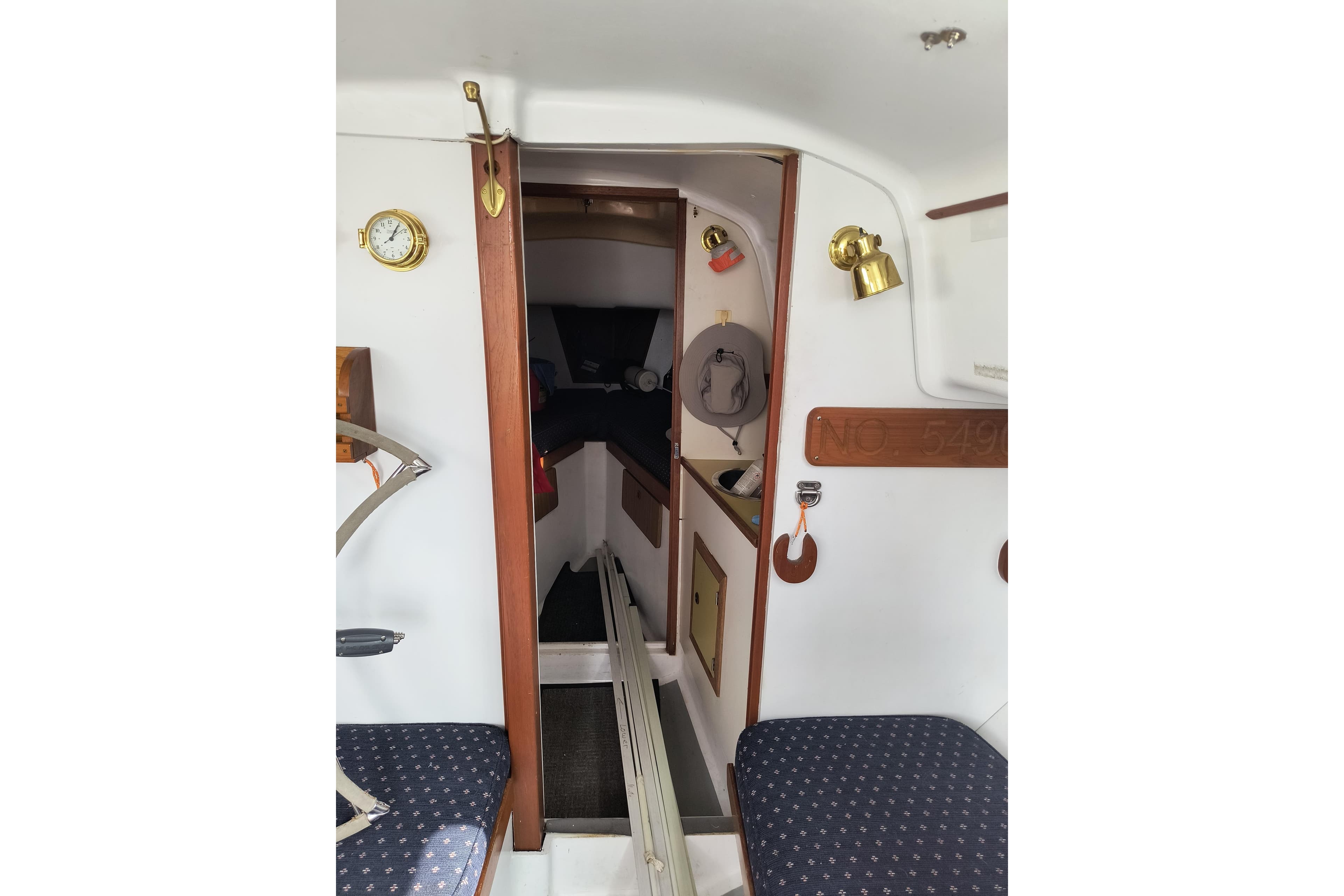 Interior of a 1971 Pearson 33 sailboat, featuring cozy cabin seating and nautical decor.