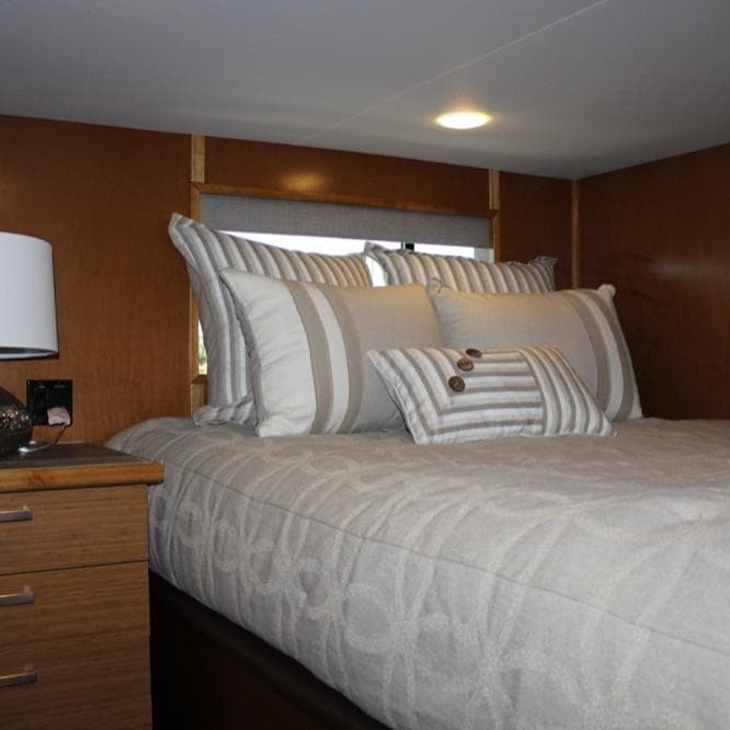 Luxurious bedroom interior in 2015 Bravada Intrepid Trip #1 houseboat.