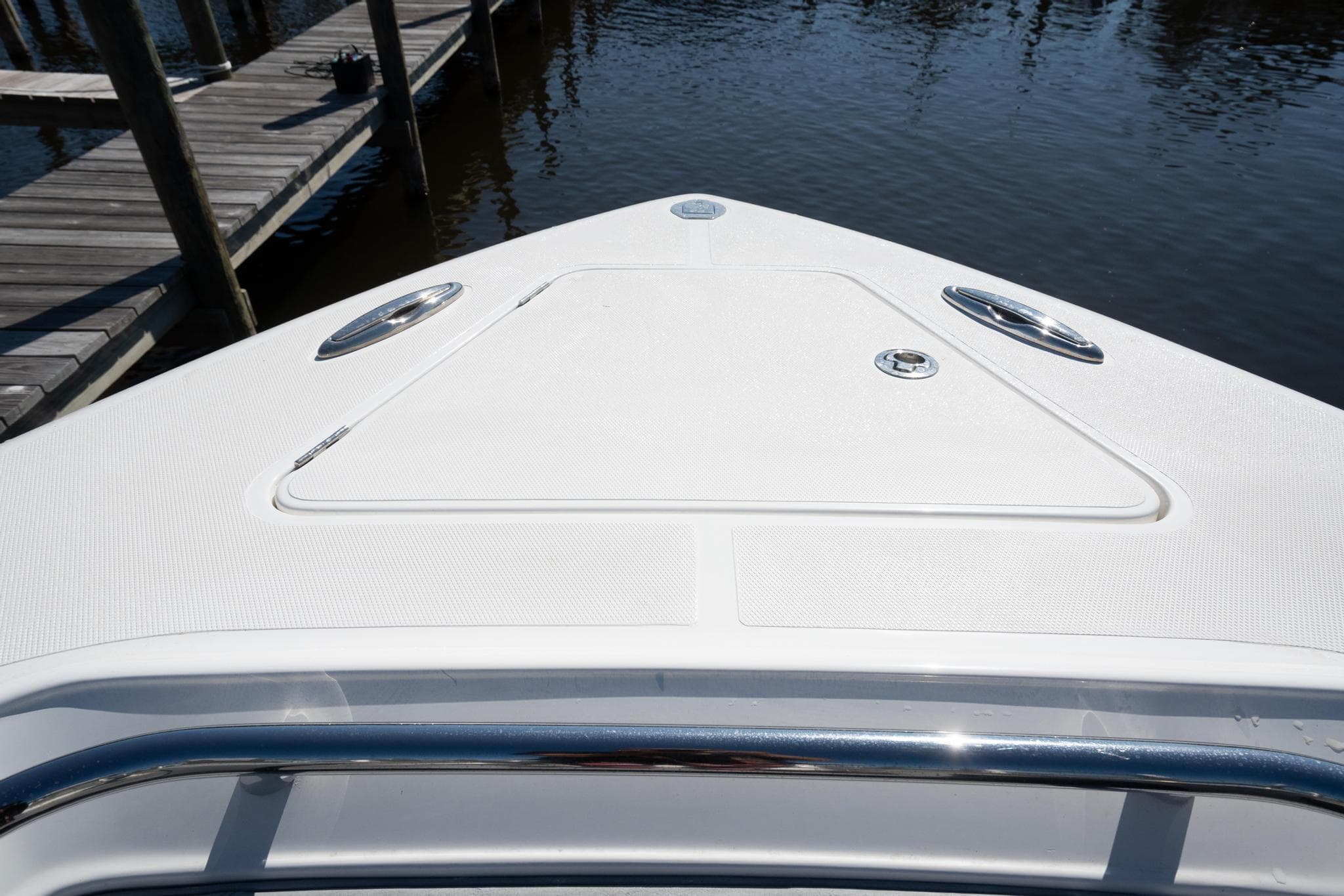 Bow of 2020 Blackwater 43 Sportfish boat at dock, featuring sleek design and stainless steel fittings.