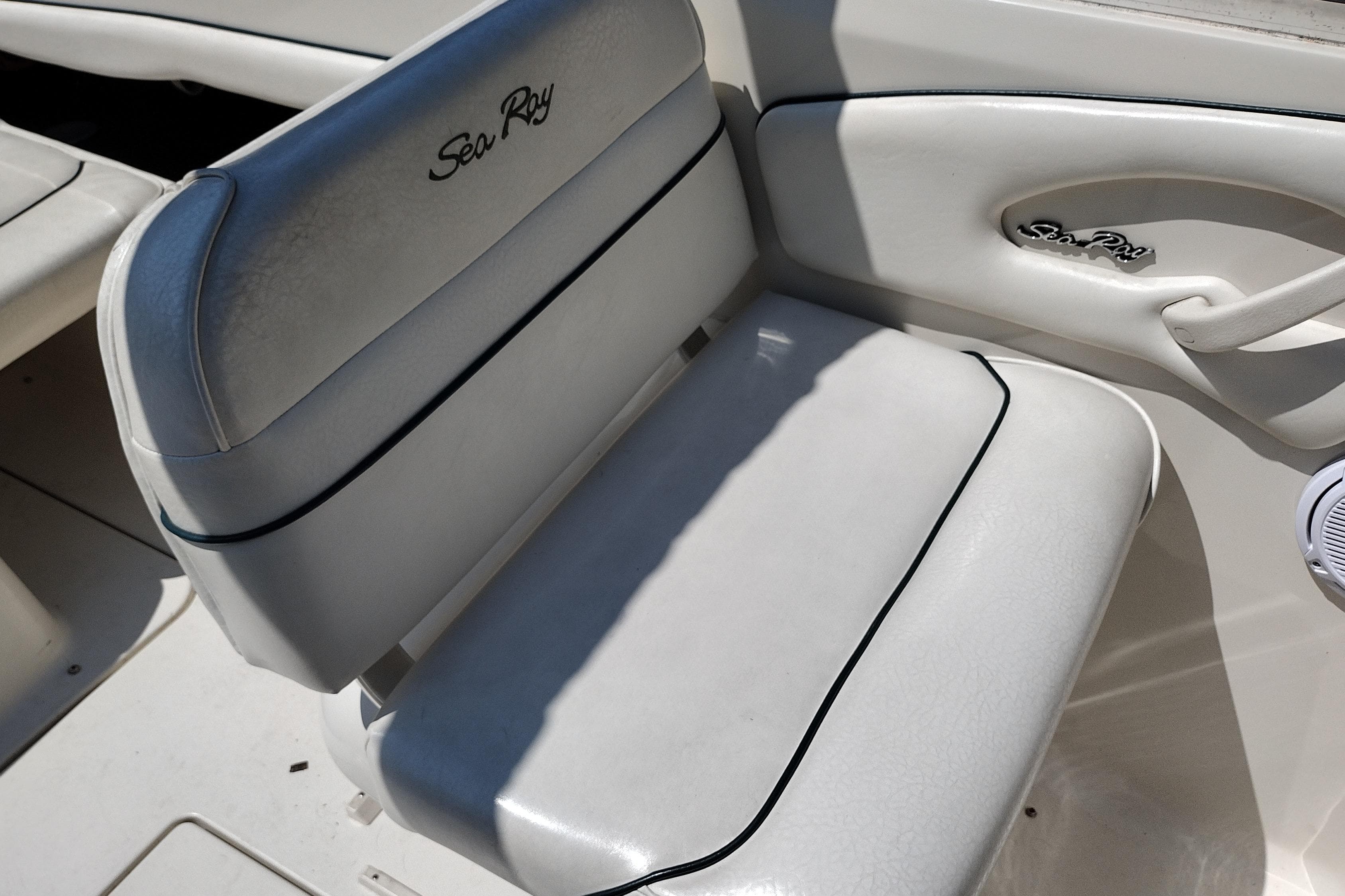 White leather seat on 1999 Sea Ray 215 Express Cruiser boat.