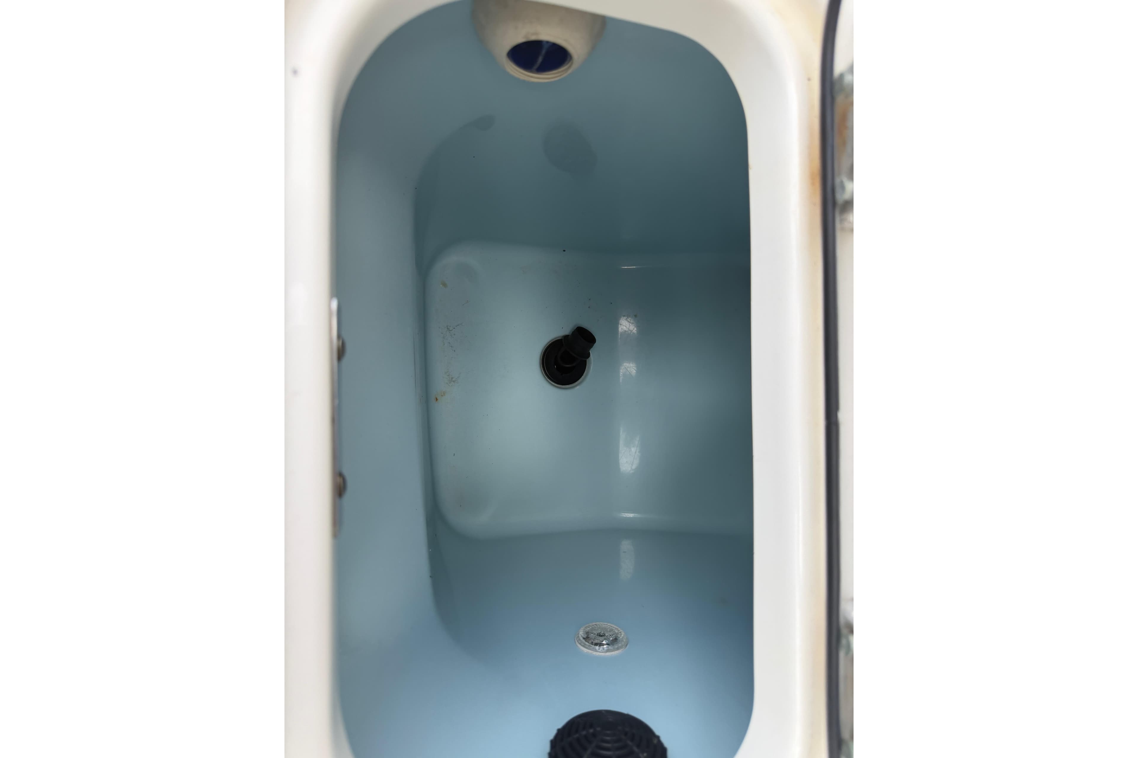Interior view of a 2016 Boston Whaler 250 Outrage livewell.