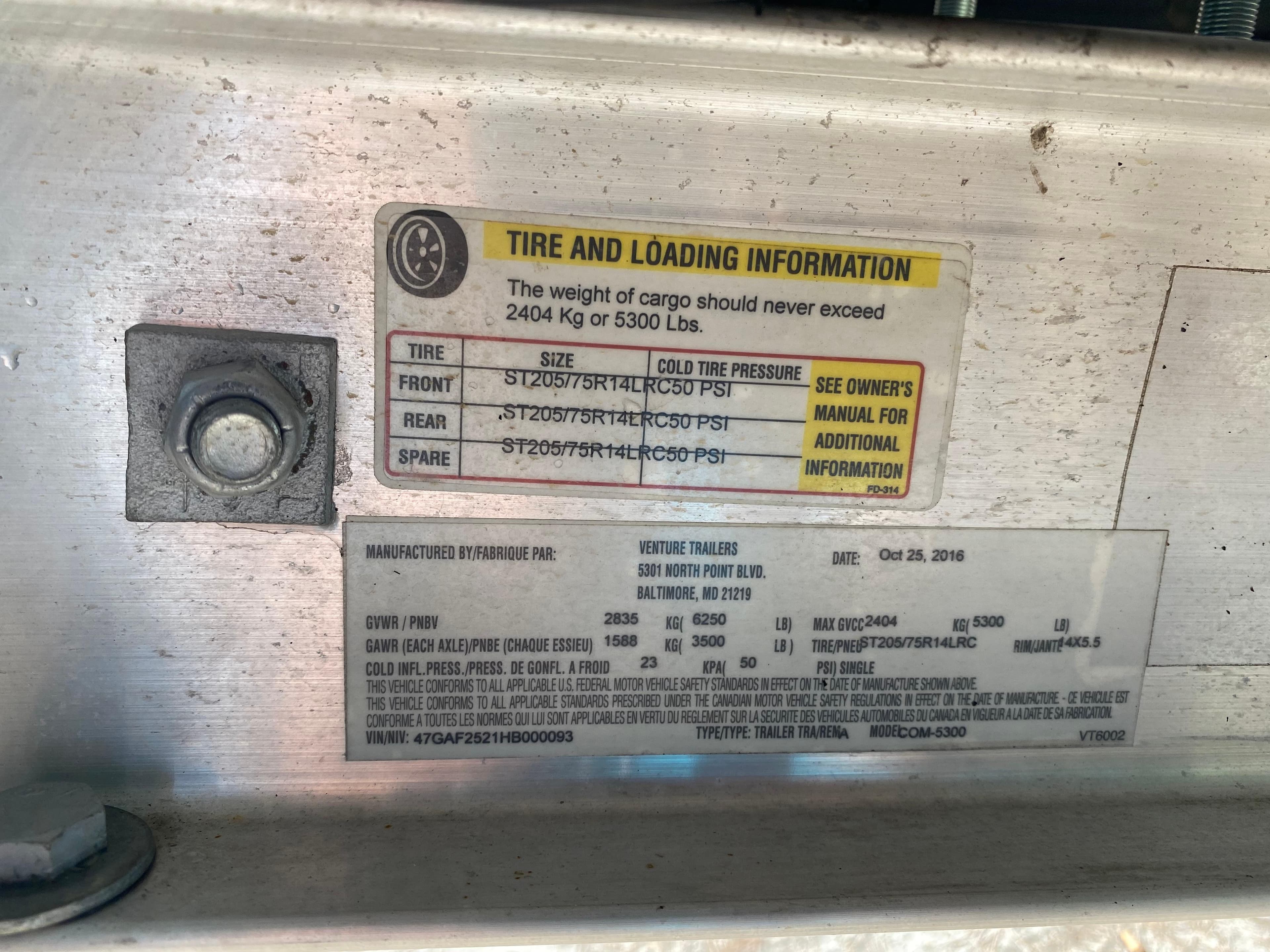 Tire and loading information label on a 2017 Regal 22 FasDeck boat trailer.