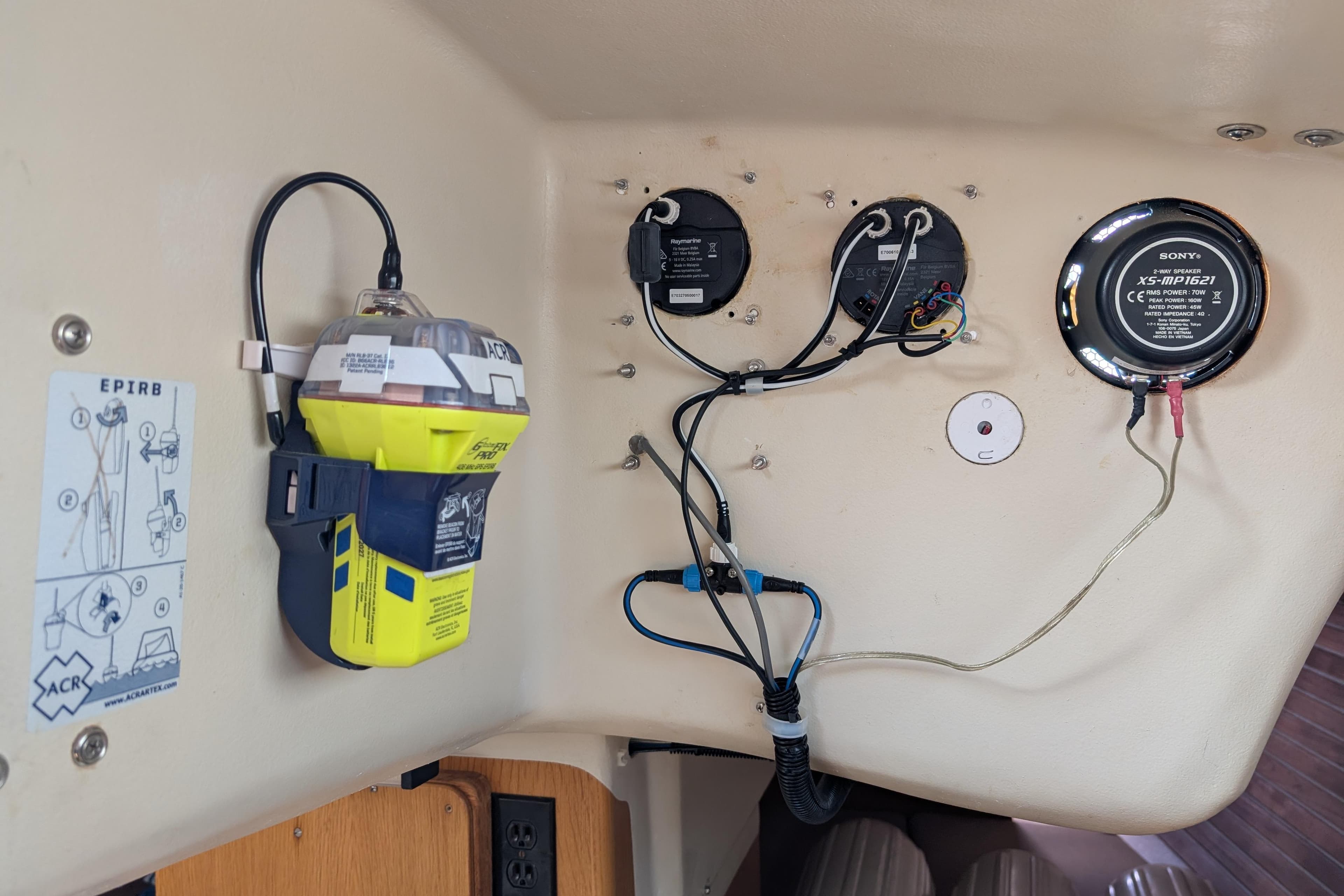 Interior of 1986 Express 37 boat showing EPIRB and wiring setup.