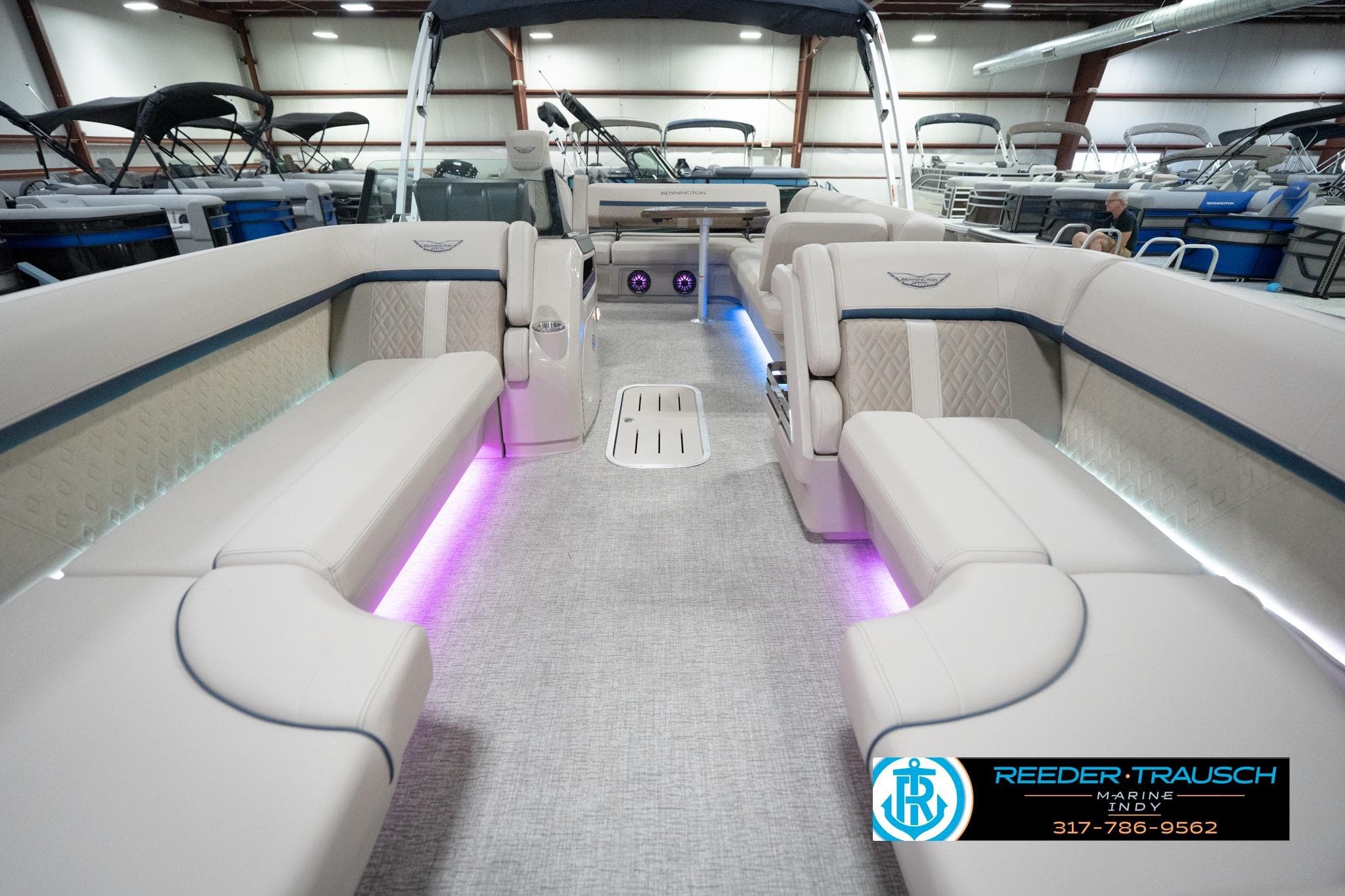 Luxurious interior of 2026 Bennington 22 ML pontoon boat with ambient lighting.