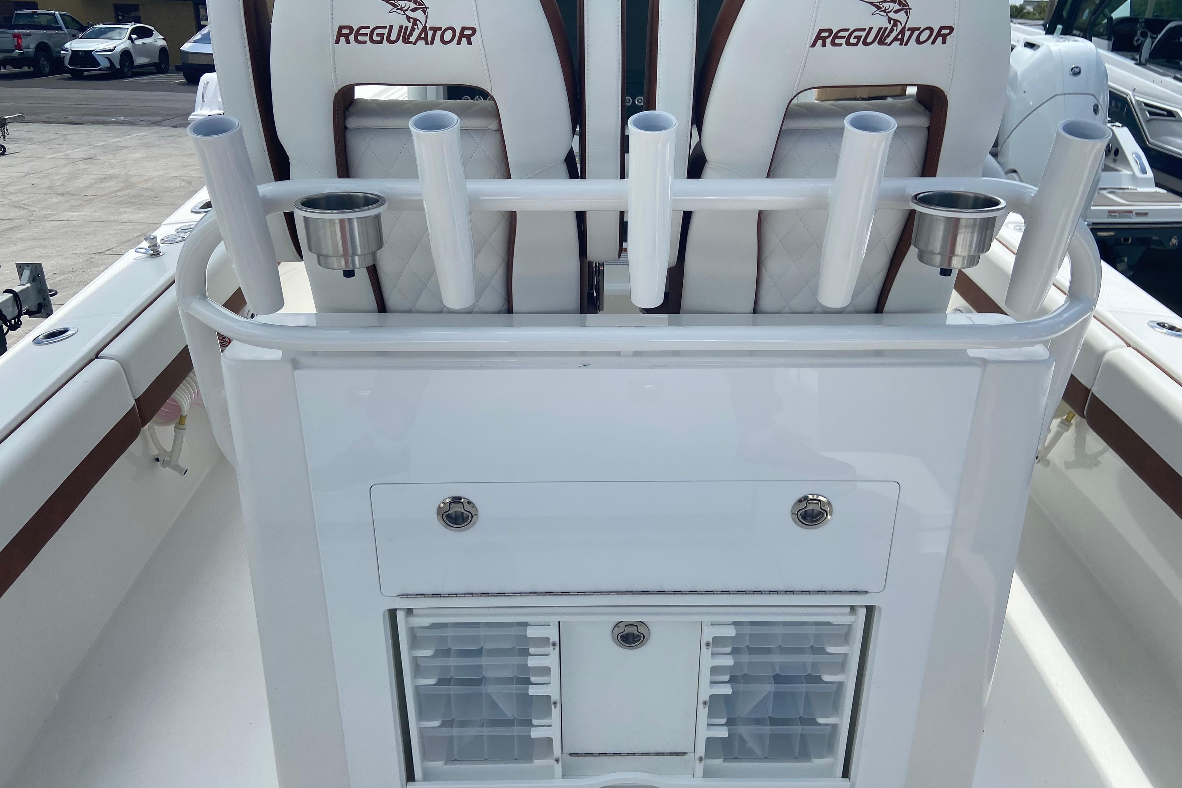 2026 Regulator 28 boat interior with rod holders and storage compartments.