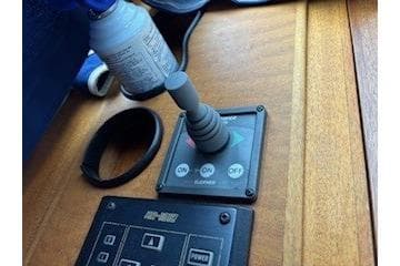 Control panel of a 2000 Storebro Royal Cruiser 395 yacht with joystick and switches.