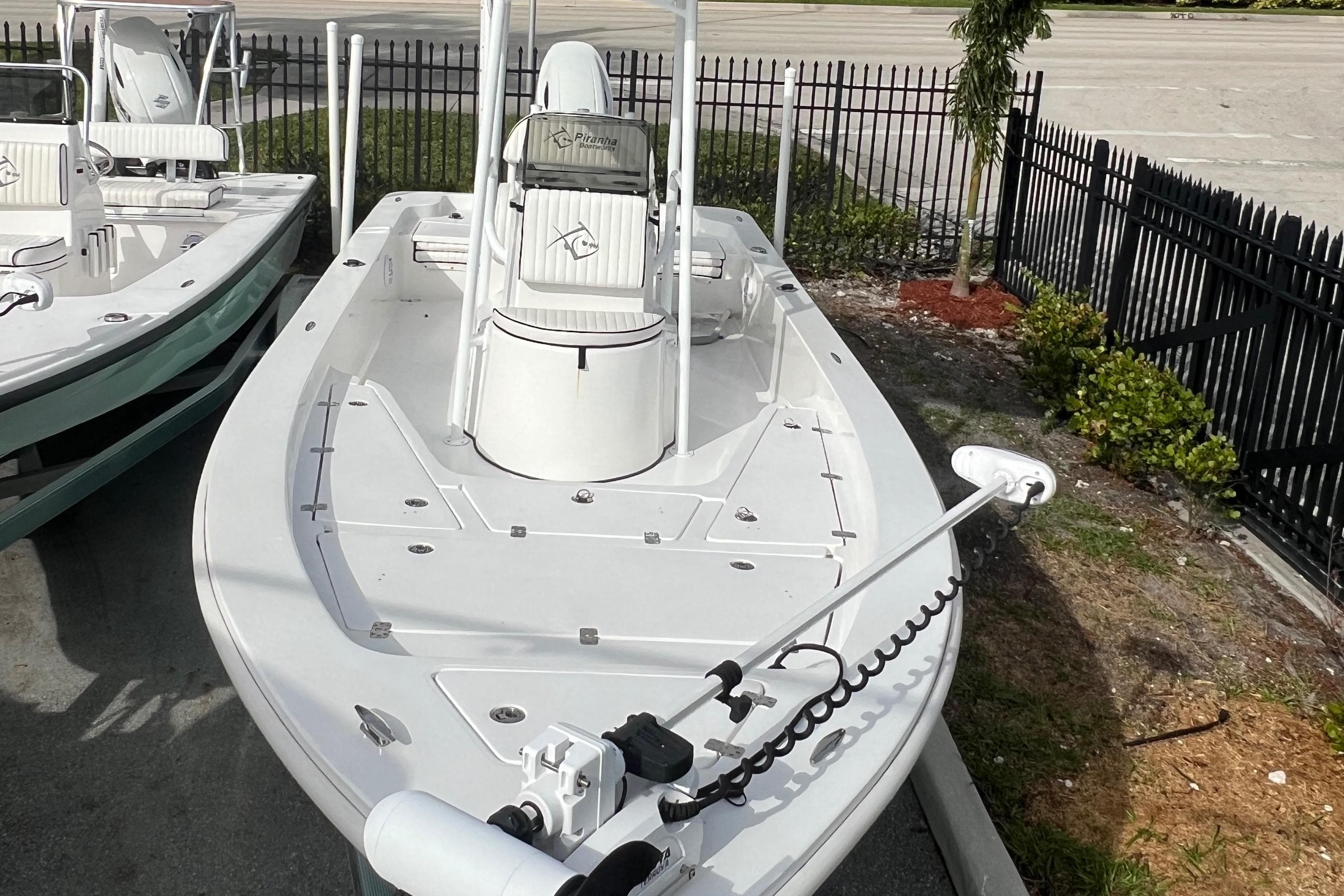 2023 Piranha B2200 CASADOR boat displayed in parking lot.