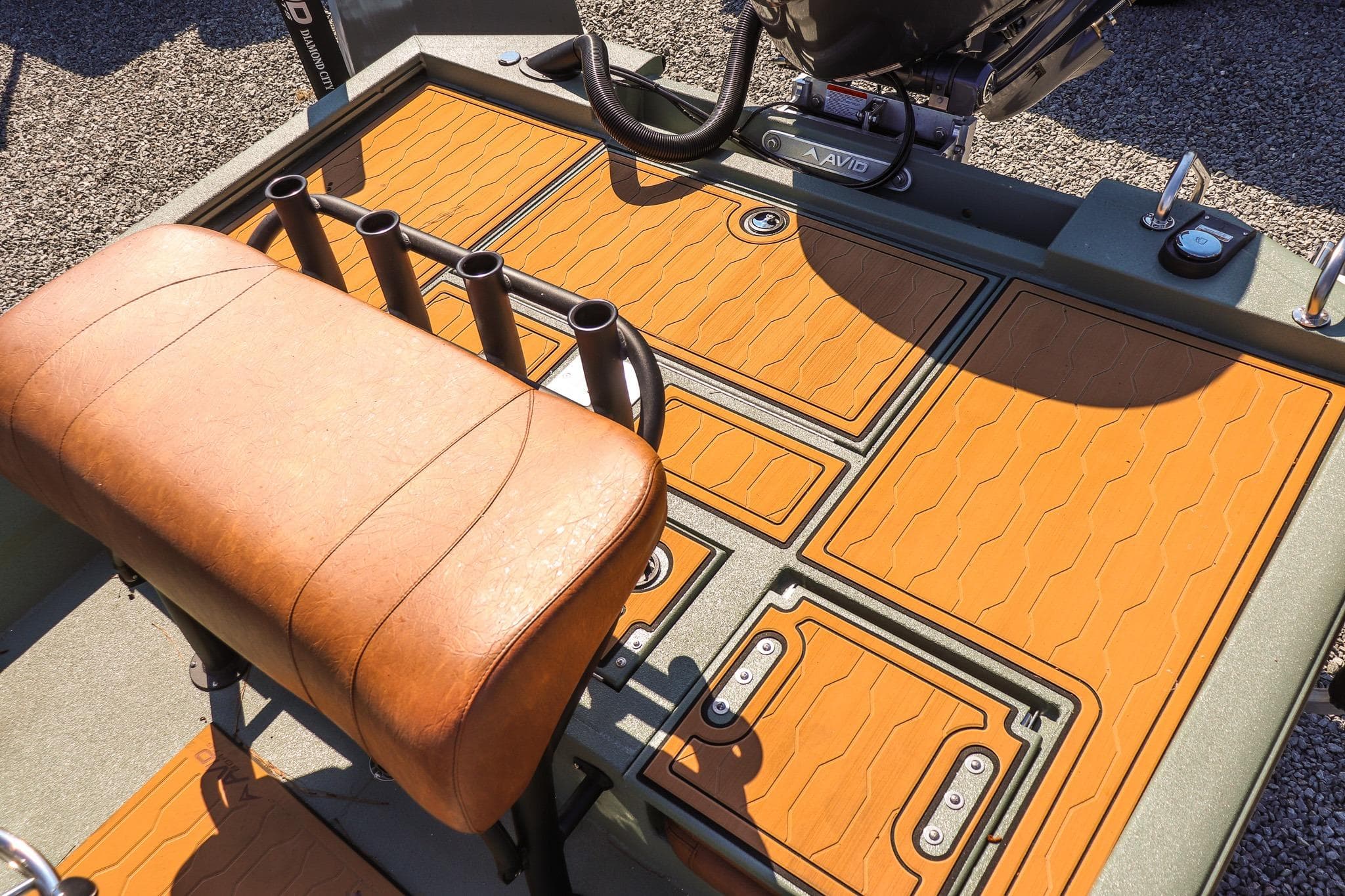2026 Avid 21 FSX boat interior with tan seating and rod holders.