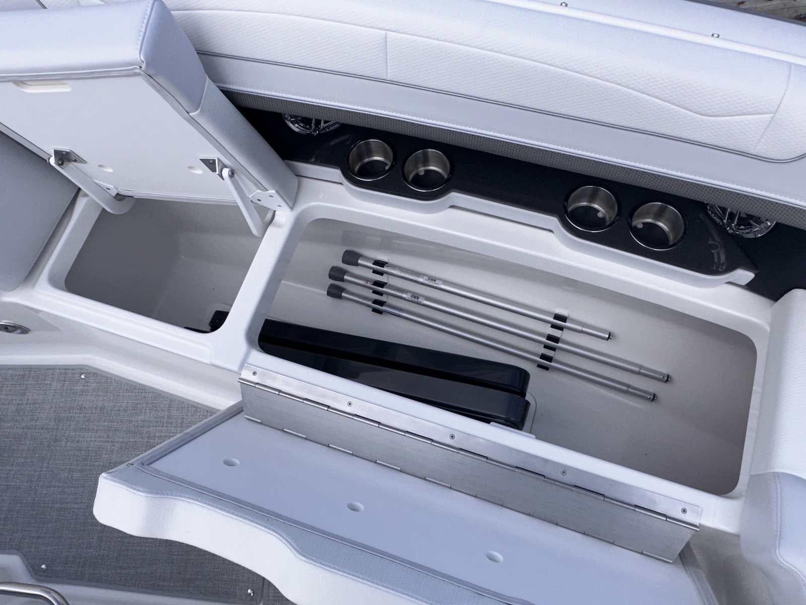 2025 Formula 350 Crossover Bowrider I/O storage compartment with cup holders and accessories.
