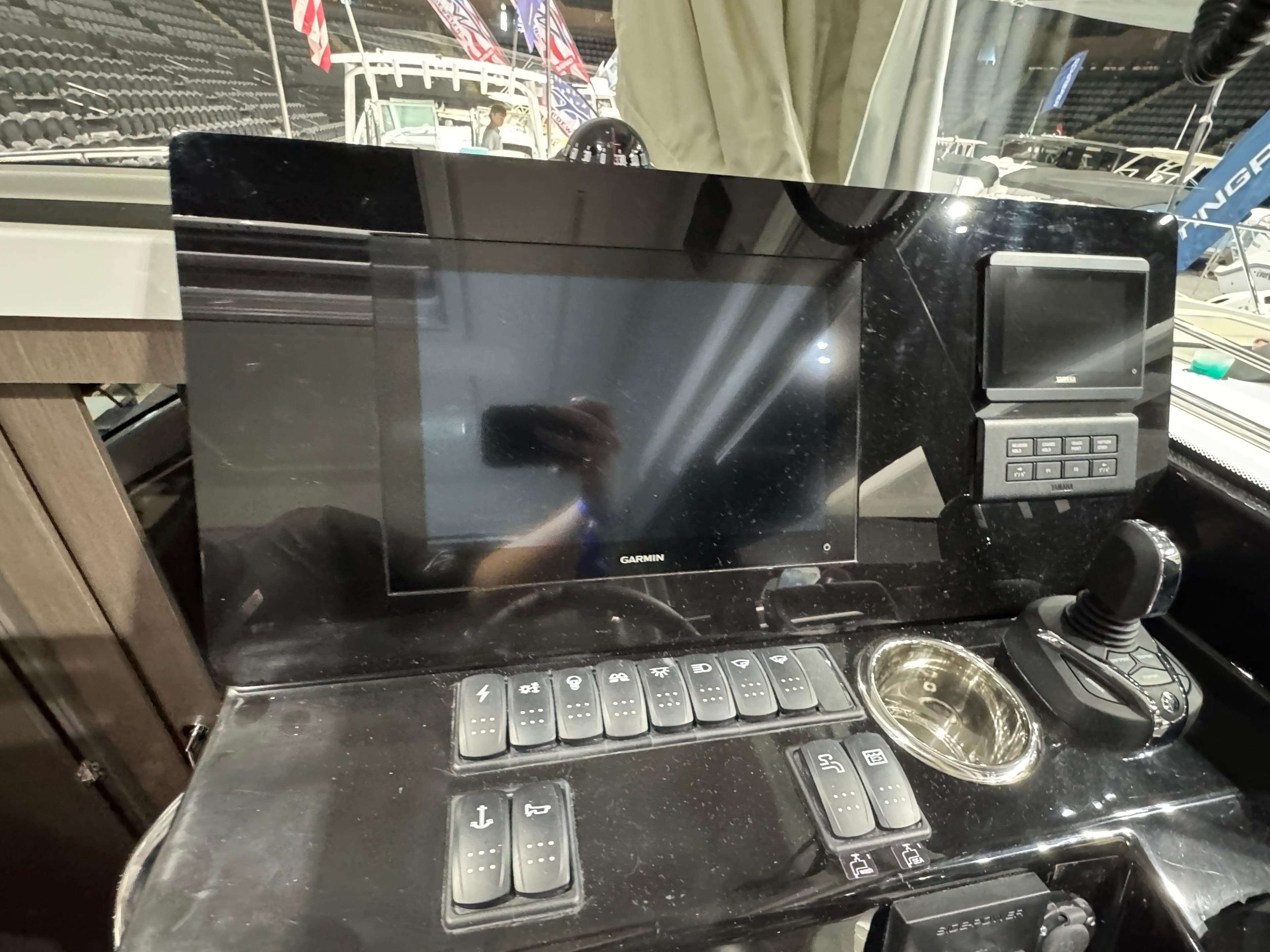 Control panel of 2025 Jeanneau NC 895 Sport Series 2 boat with navigation display.