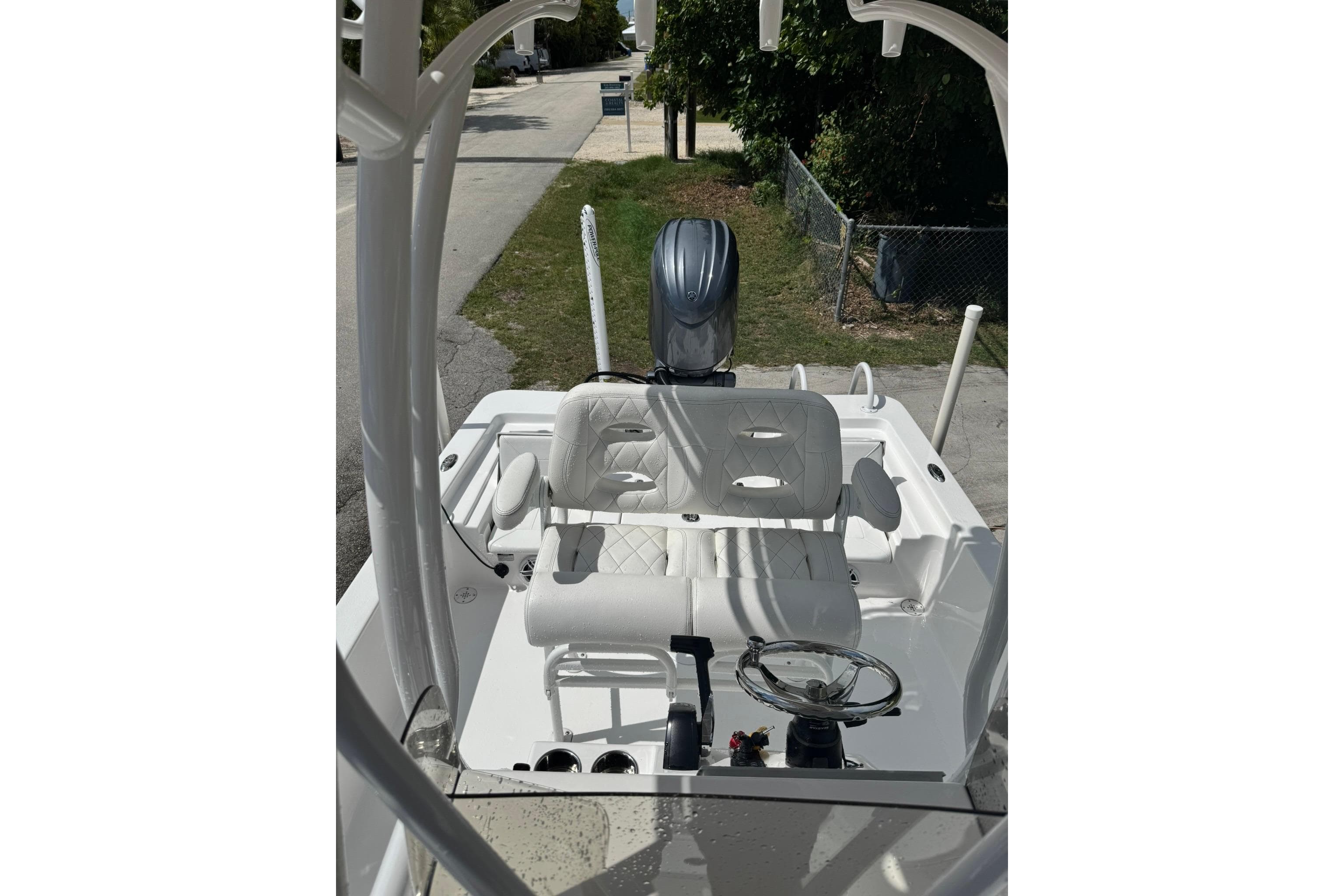 2024 Blazer Bay 2220 Fisherman boat interior with steering wheel and seating.