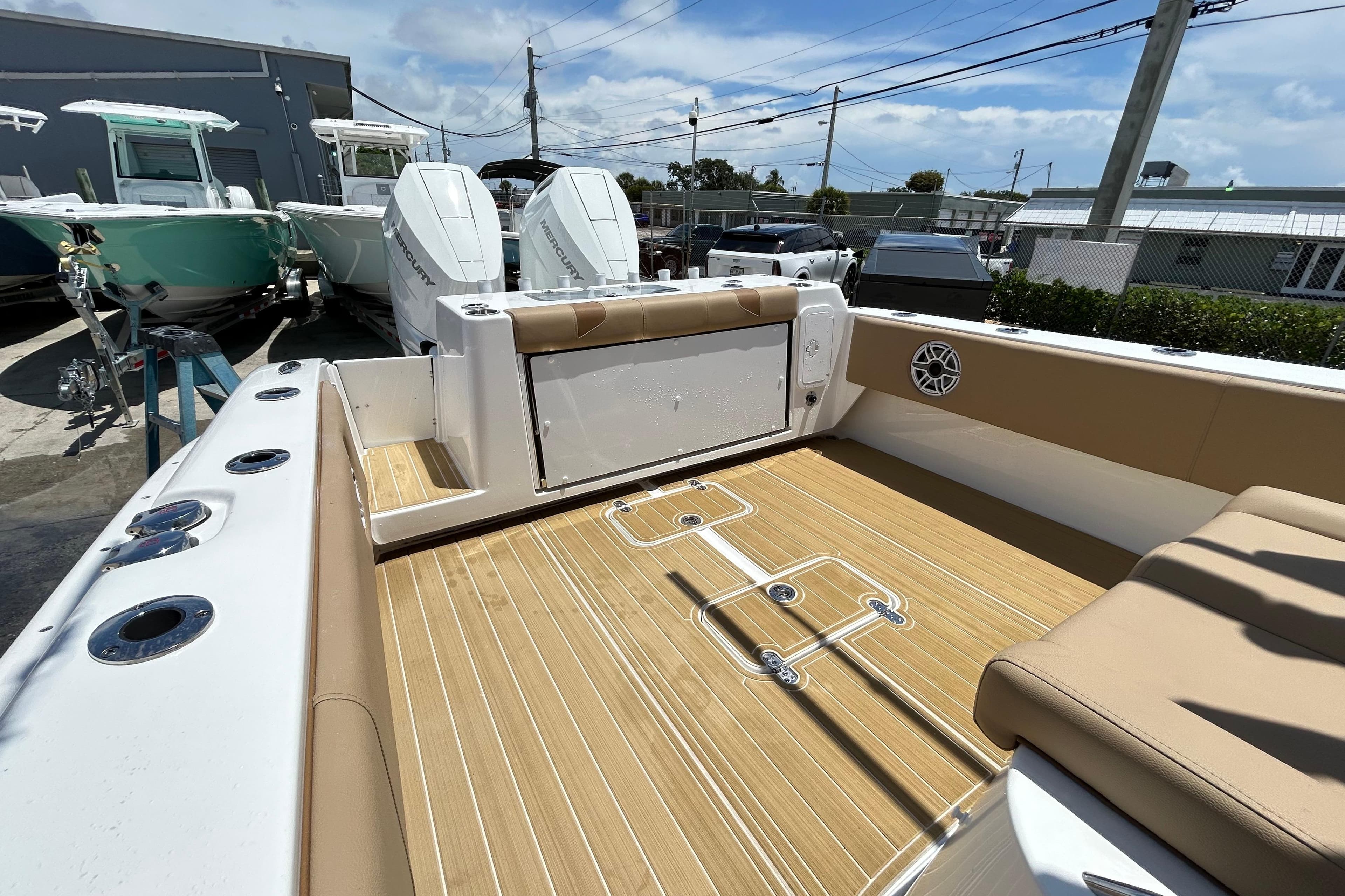 2025 Cape Horn 34 XS boat interior with tan seating and wood-style flooring.