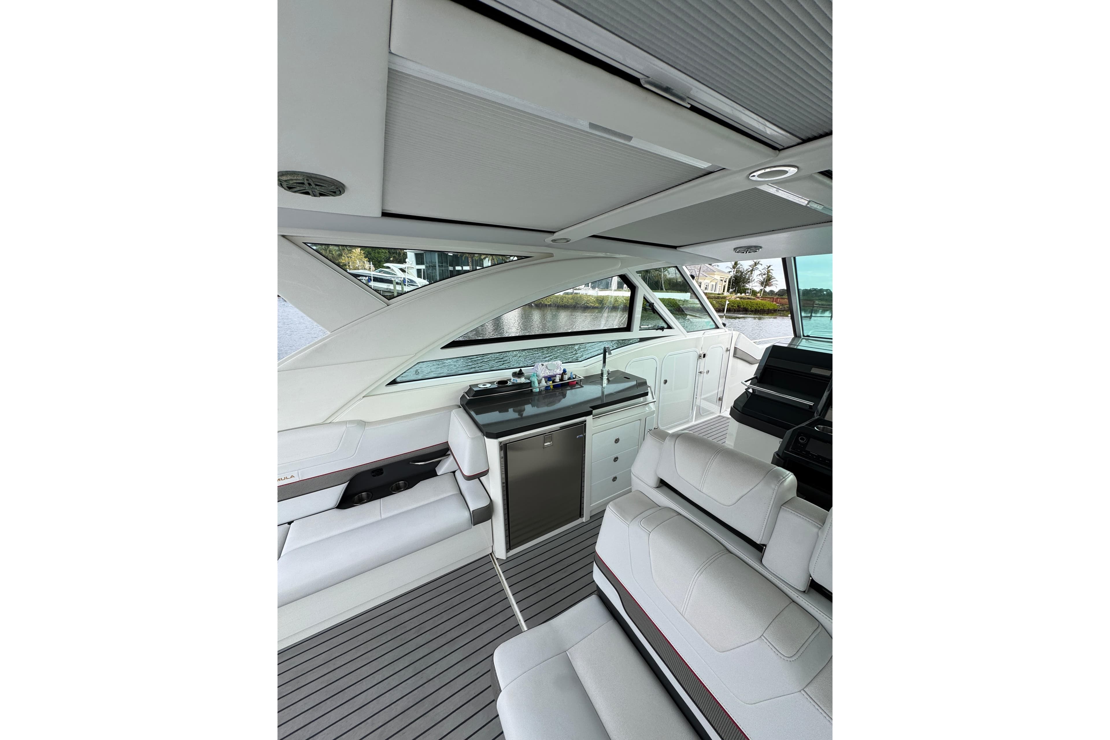 Interior of 2018 Formula 430 Super Sport Crossover yacht, featuring sleek seating and modern design.
