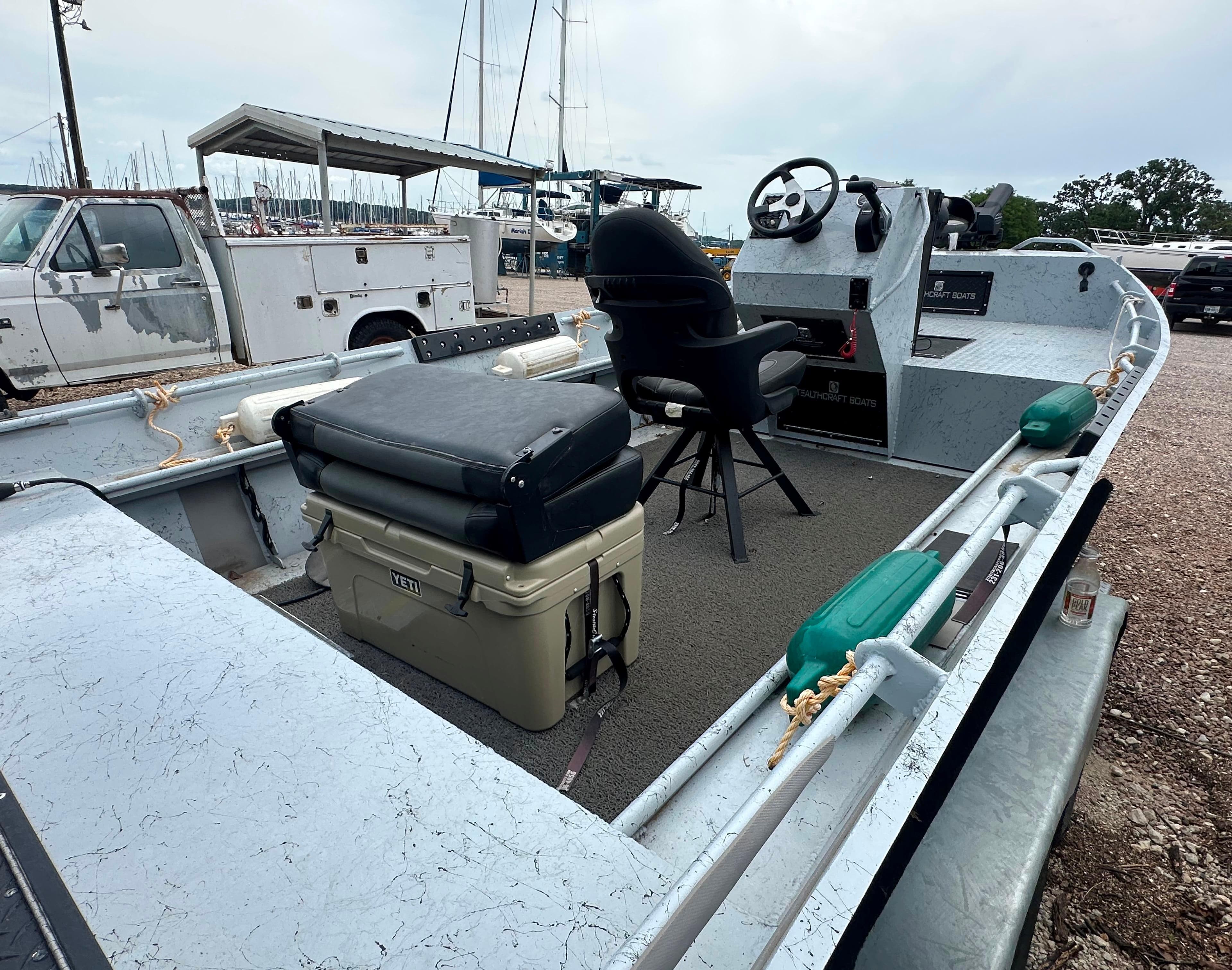 2023 StealthCraft Stealthweld 18 boat interior with seating and steering console.