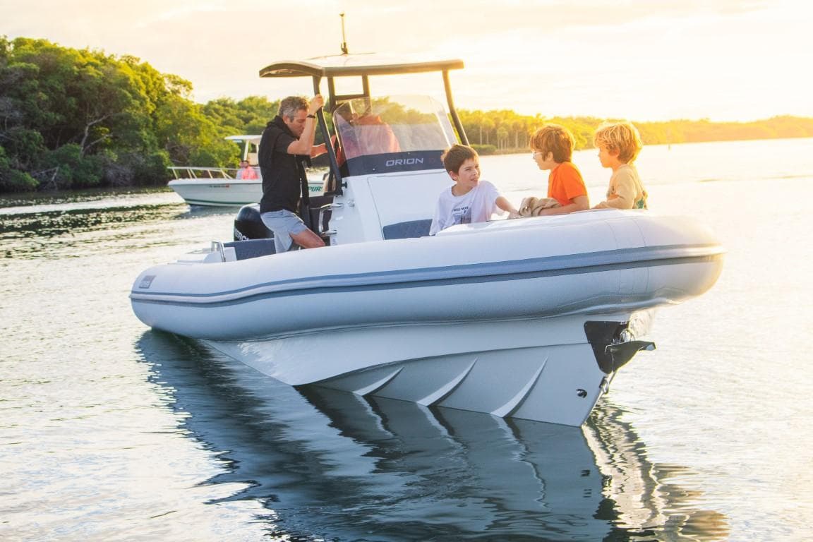 2024 Northstar Orion 8 boat on water with people enjoying a sunny day.