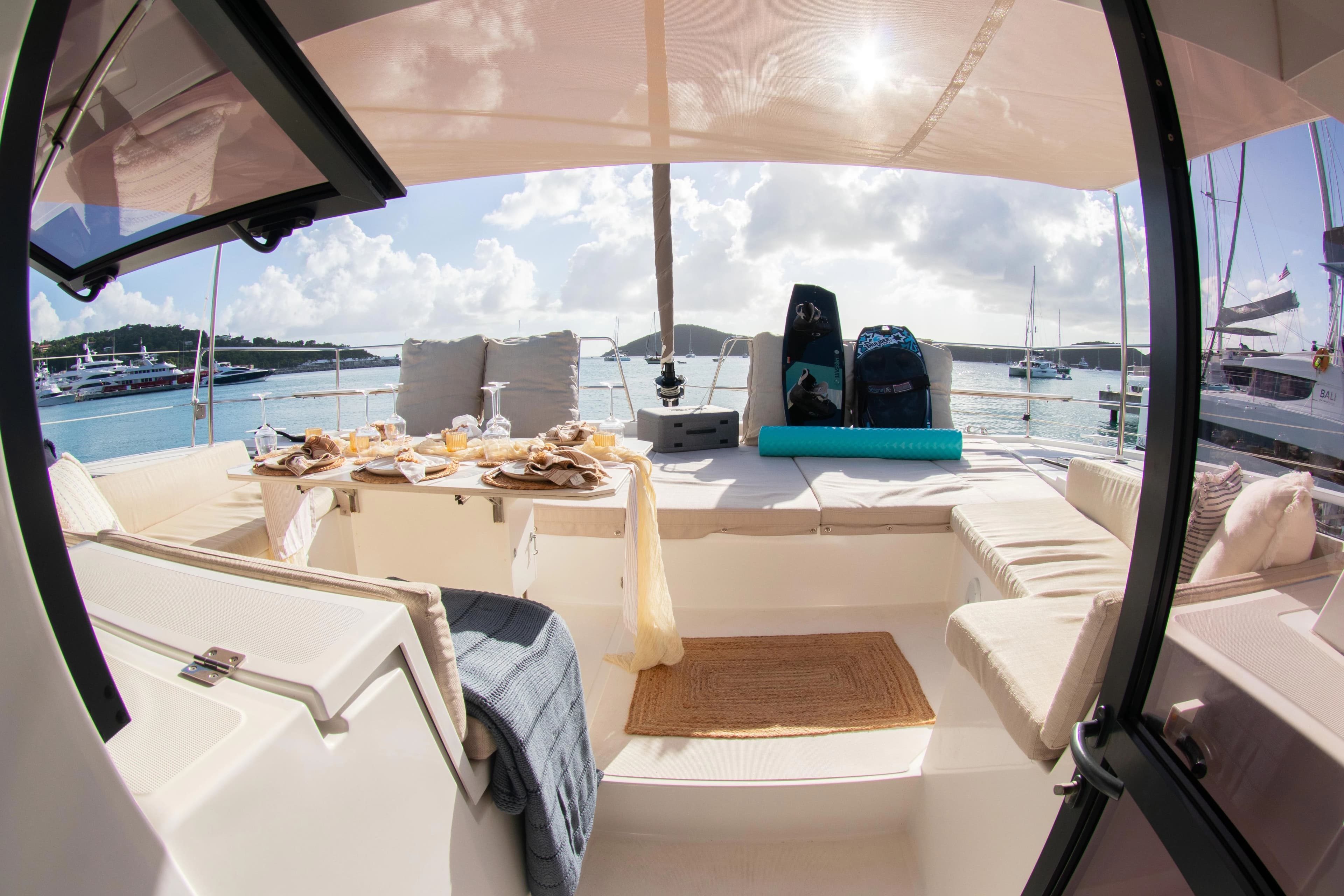 Luxurious Bali 4.8 catamaran deck with set dining table, 2021 model.