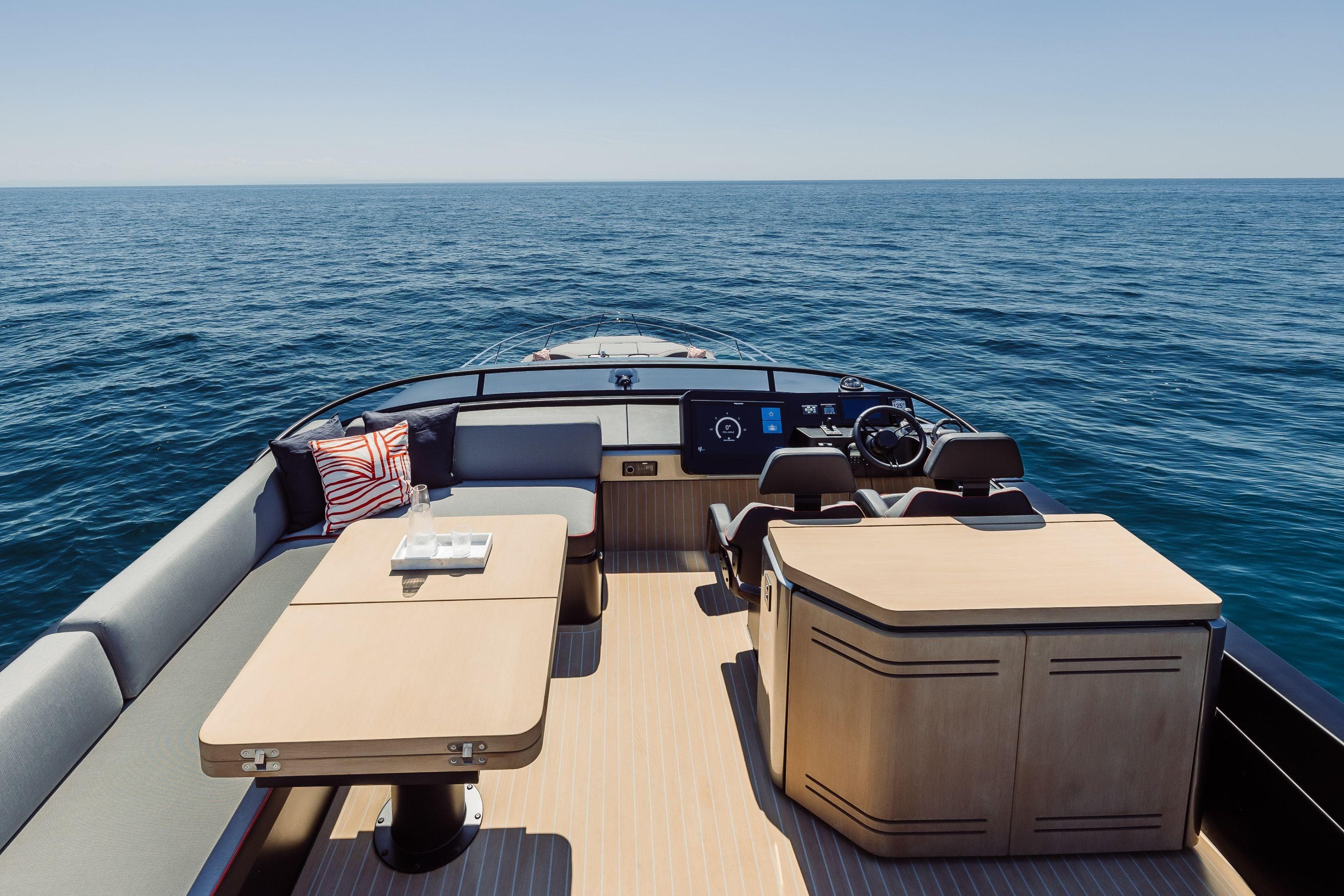 Luxurious 2026 Cranchi Sessantasette 67 Corsa yacht interior with ocean view.