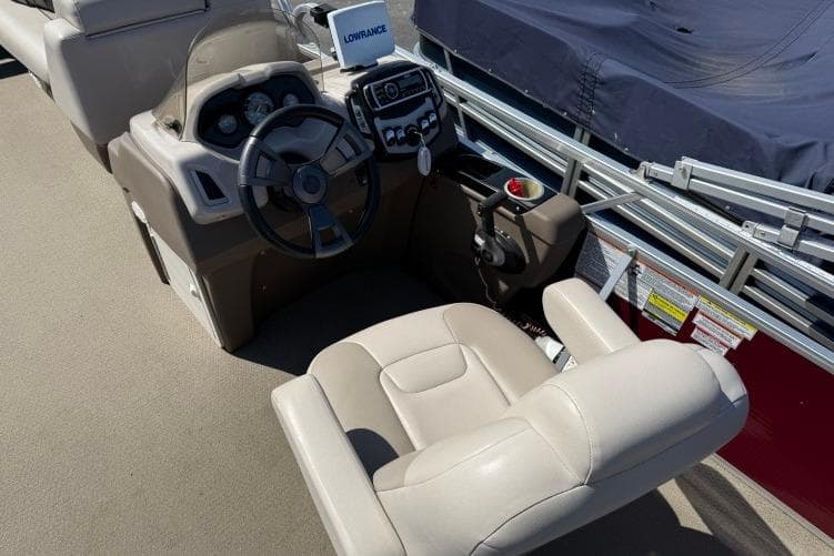 2016 Princecraft Vectra 21 boat cockpit with steering wheel and control panel.