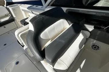 2022 Robalo R317 Dual Console boat interior seating with white and black upholstery.