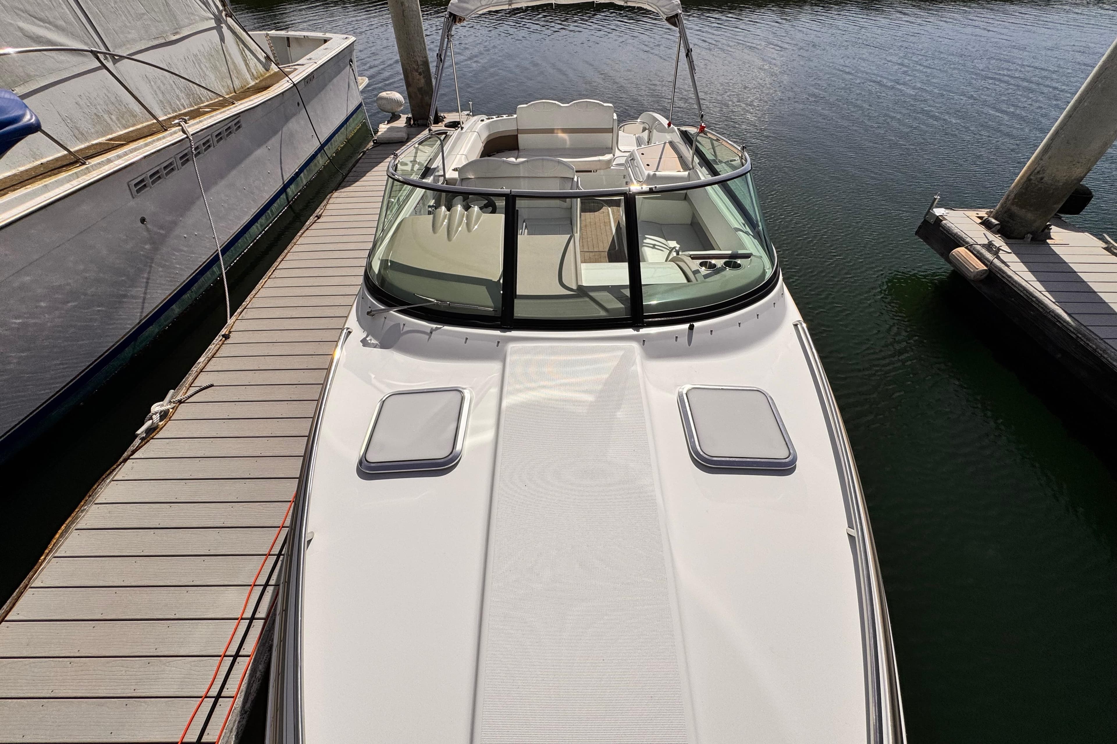 2012 Formula 290 Sun Sport boat docked at marina, top view.