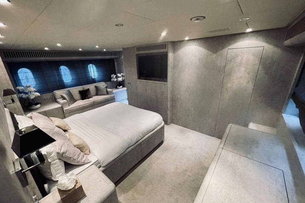 Luxurious bedroom interior on 2008 Leopard 31 OPEN yacht, featuring modern design and elegant furnishings.