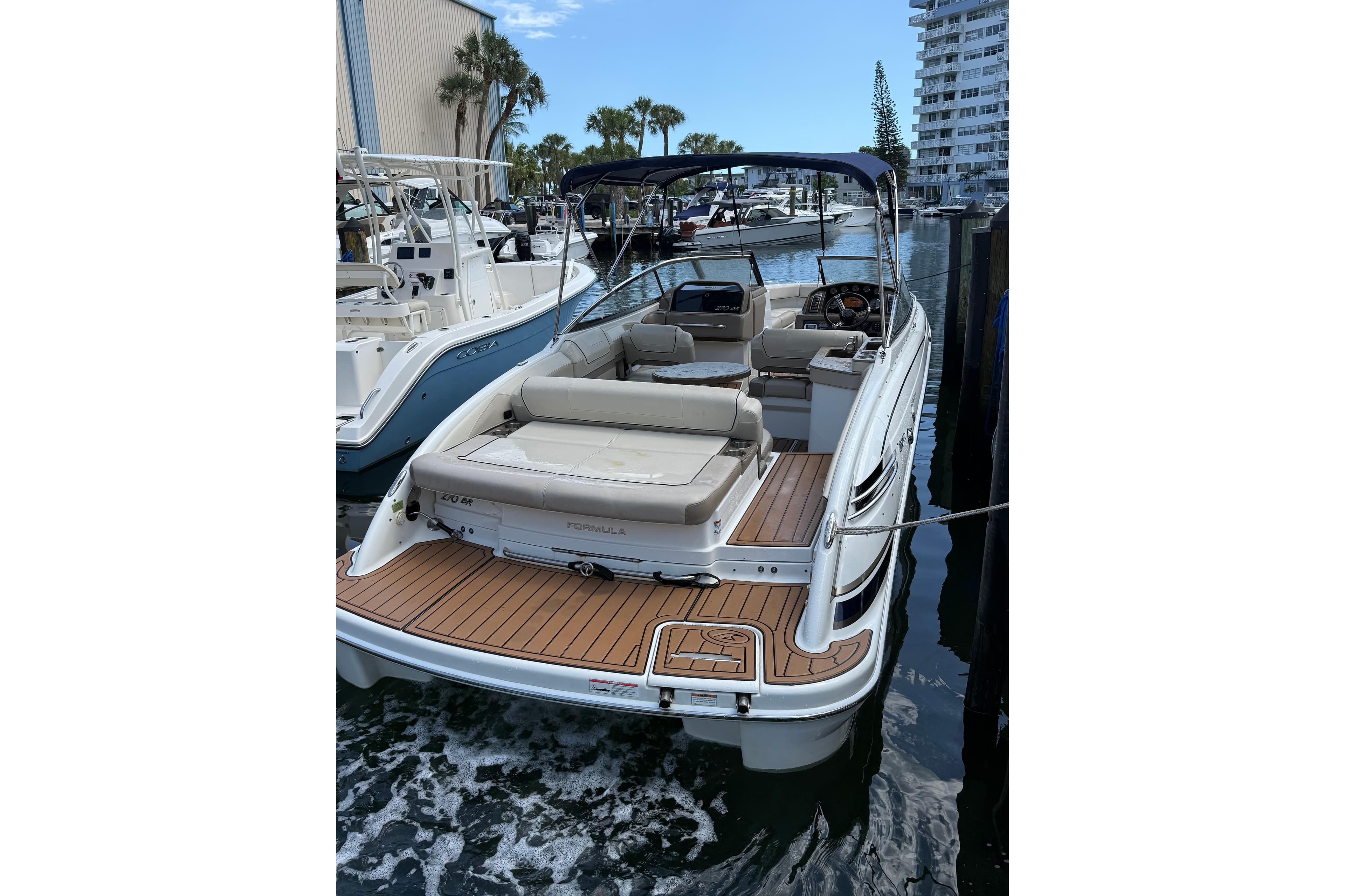 2019 Formula 270 Bowrider docked, featuring spacious seating and sleek design.