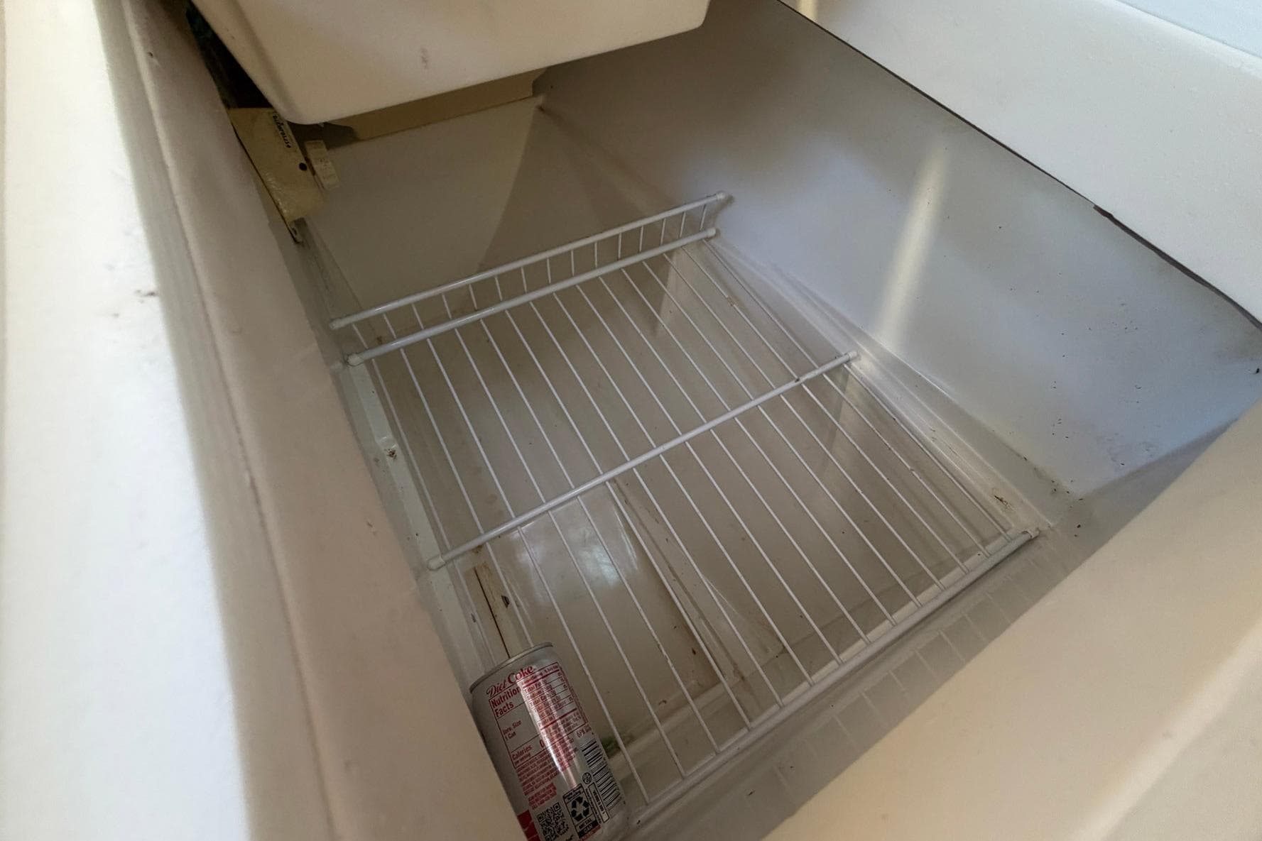 Empty refrigerator compartment in a 2001 Catalina 36 MkII sailboat.