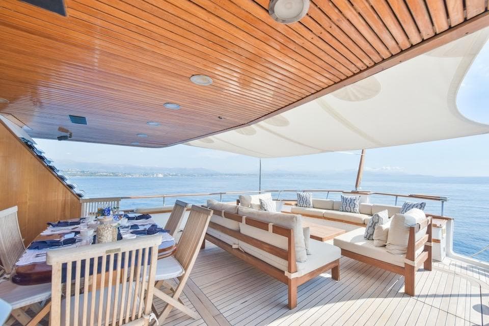 Luxurious deck of 1984 W.A. Souter & Sons yacht with elegant seating and ocean view.