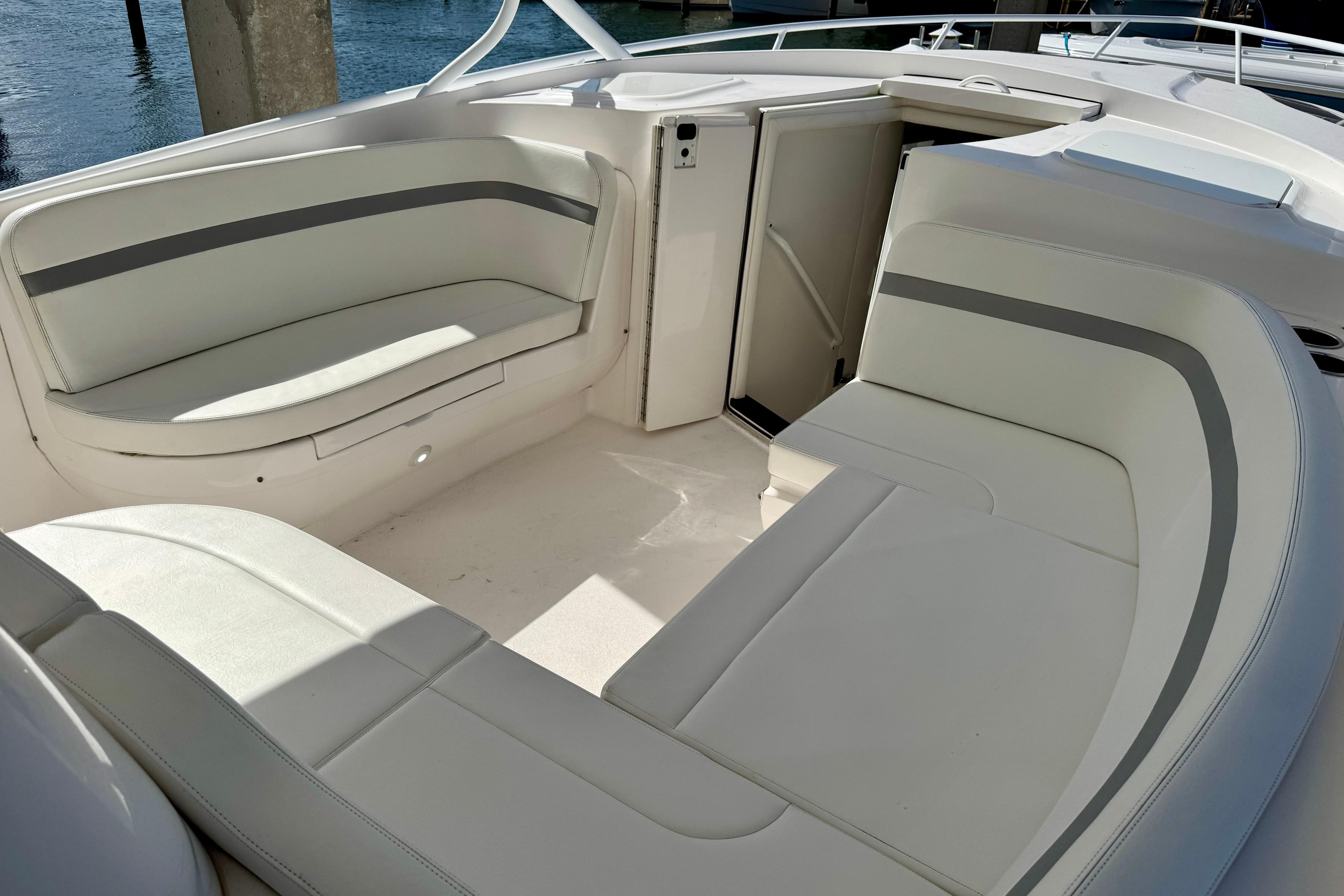 2019 Intrepid 407 Cuddy boat interior with white cushioned seating.