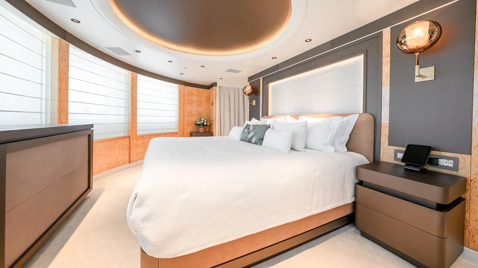 Luxurious bedroom interior on a 2015 Benetti yacht, featuring modern design and elegant lighting.