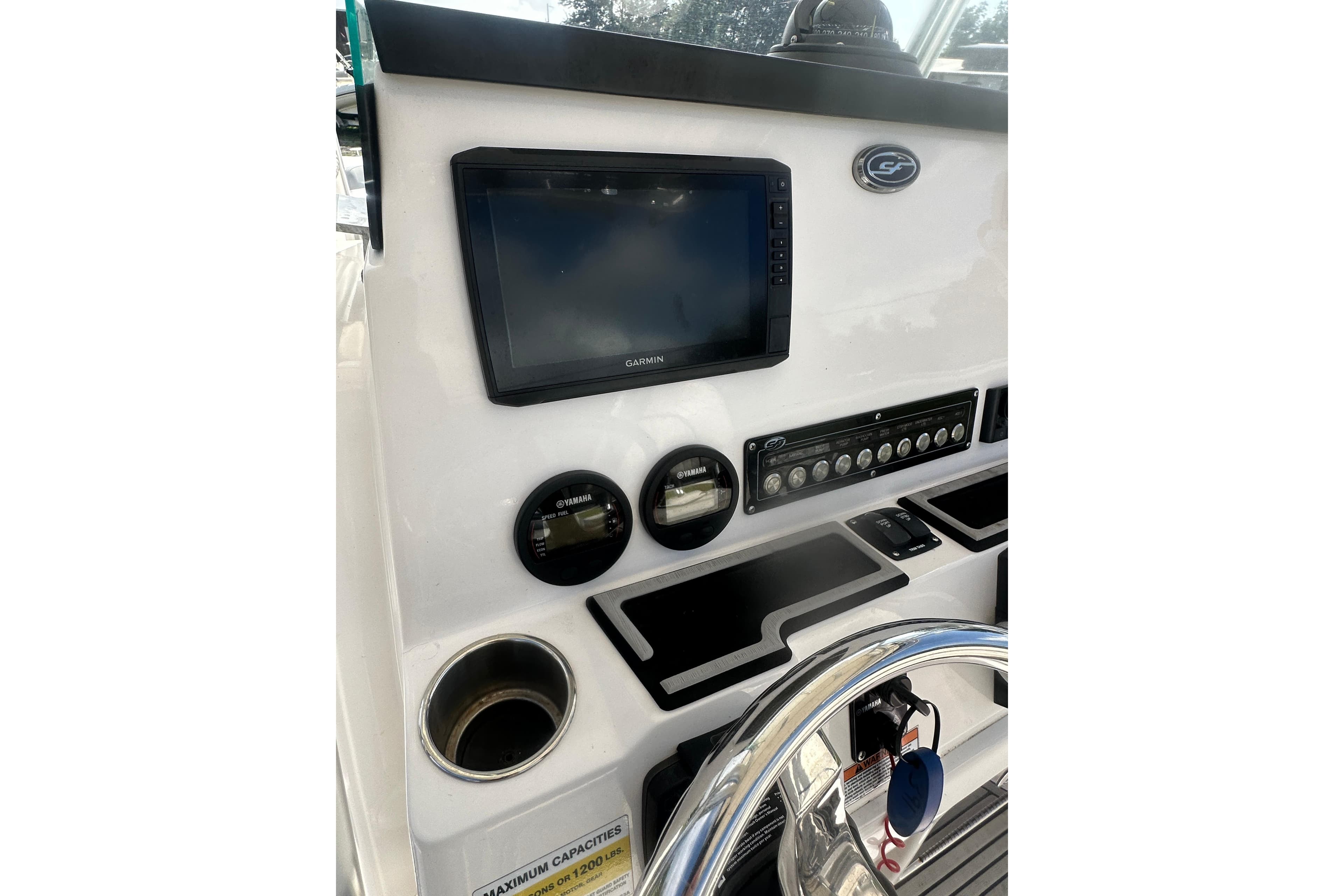 2023 Sea Fox 228 Commander dashboard with Garmin display and controls.