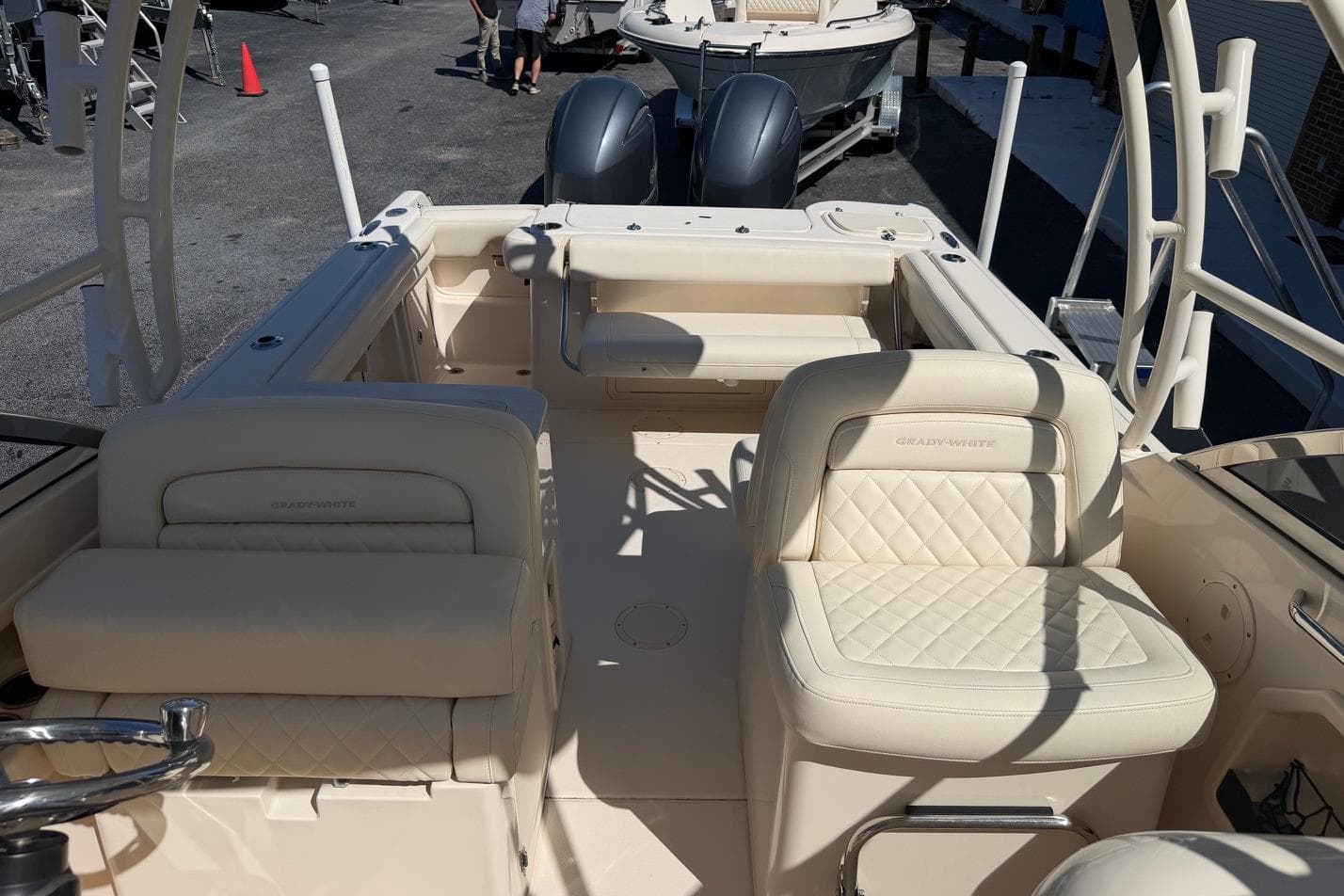 2022 Grady-White Freedom 275 boat interior with cream seating and dual engines.