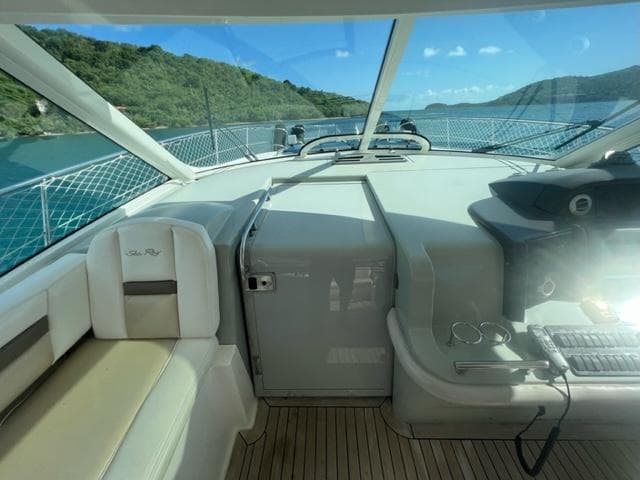 Interior view of 2012 Sea Ray 500 Sundancer yacht with scenic ocean backdrop.