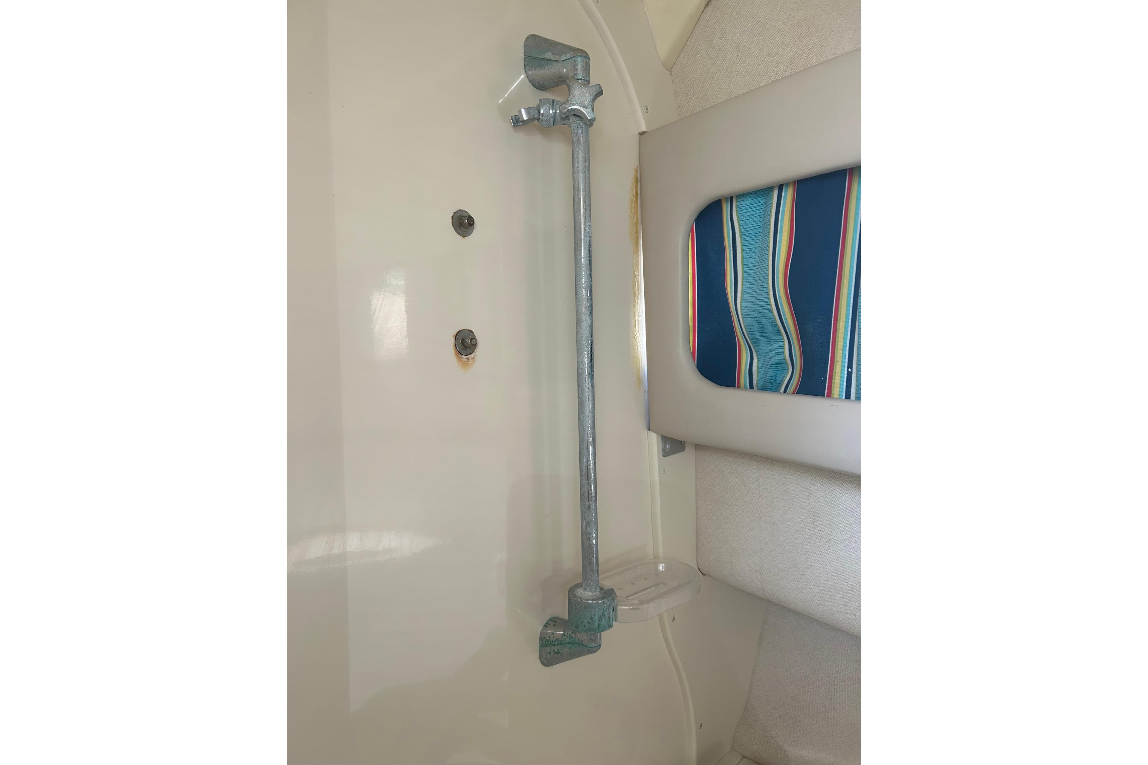 Interior detail of a 1999 Grady-White Marlin 300 boat, featuring a metal support bar.