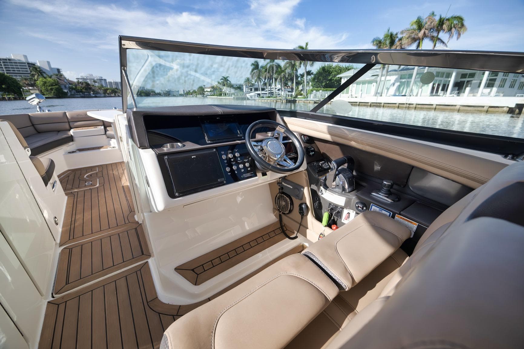 2016 Sea Ray 350 SLX boat interior with luxurious seating and modern dashboard controls.