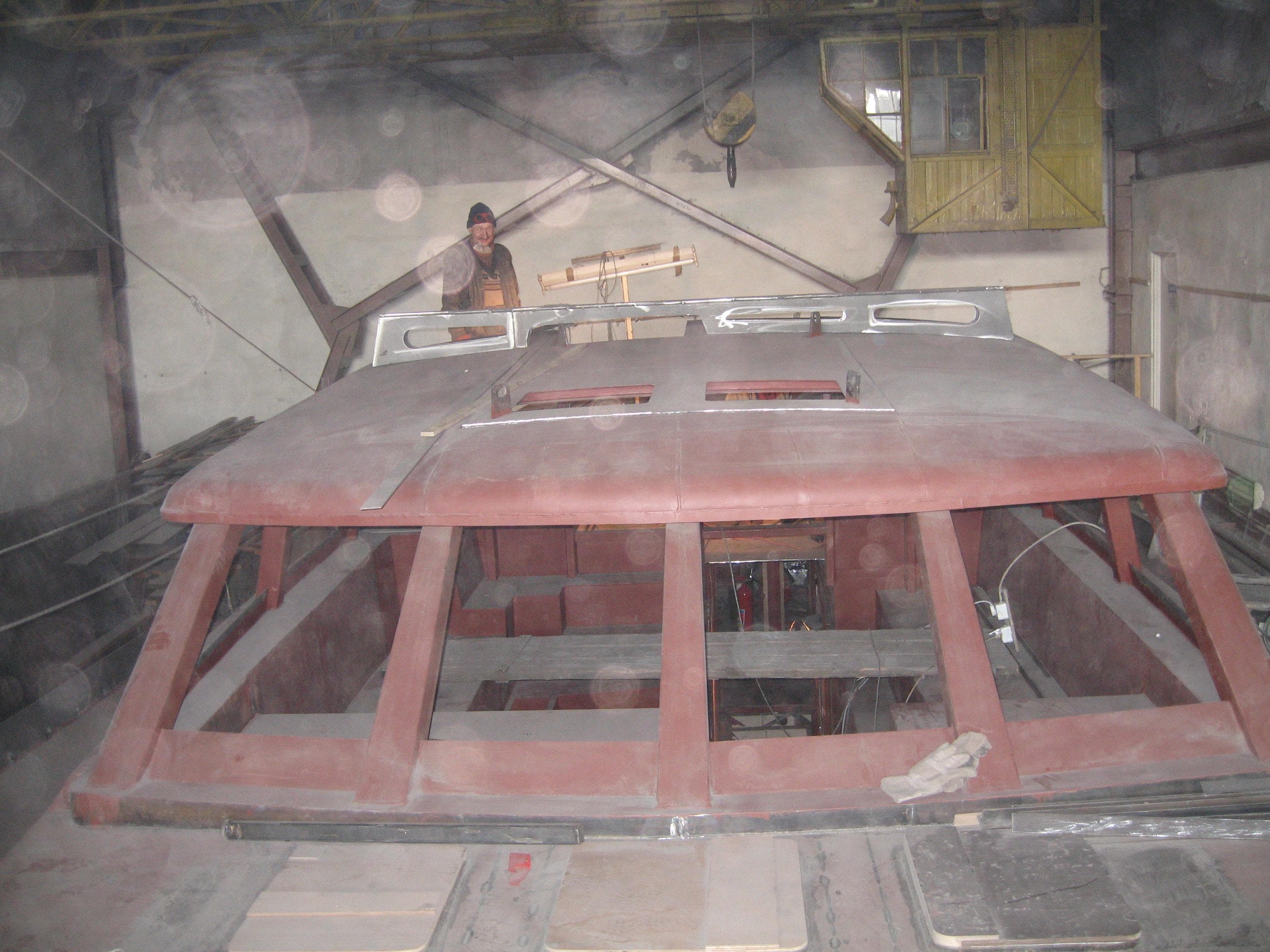 Custom Line SM Europe SMY84 yacht under construction in a workshop, 2022.
