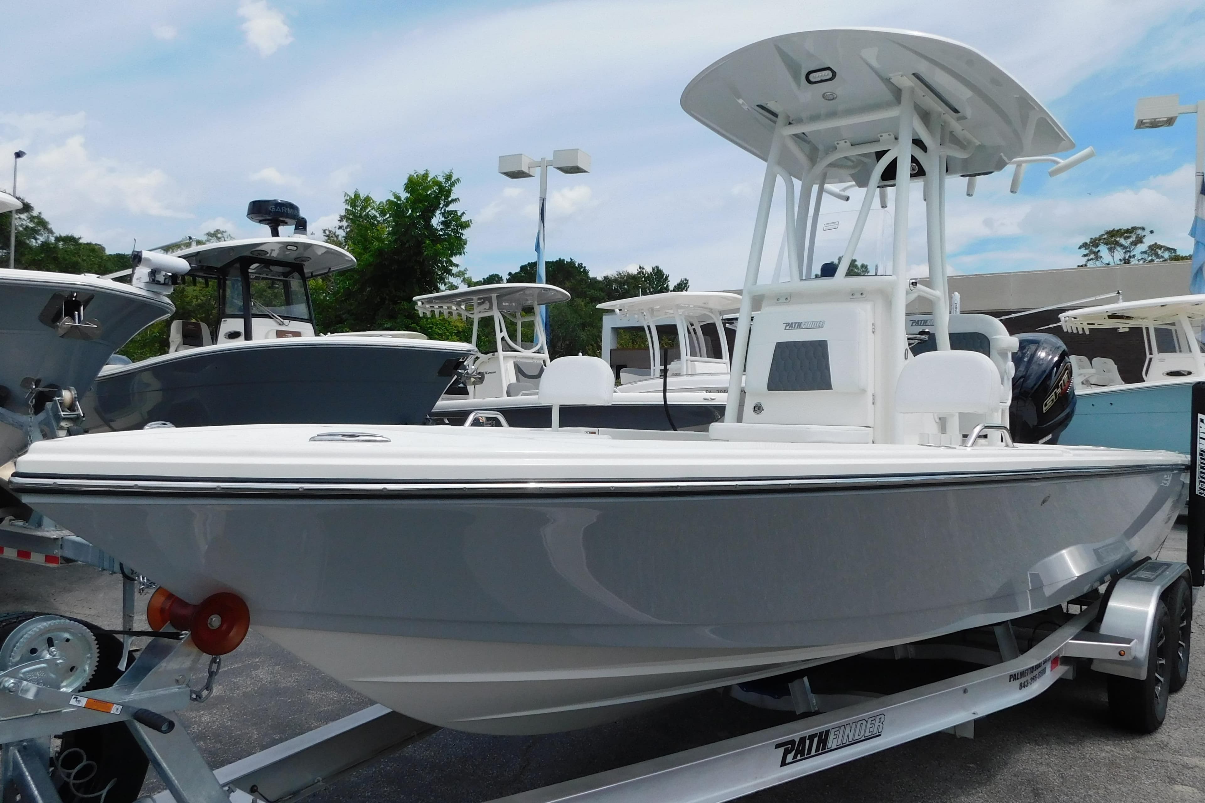 2026 Pathfinder 2200 TRS boat on trailer, displayed outdoors with other boats.